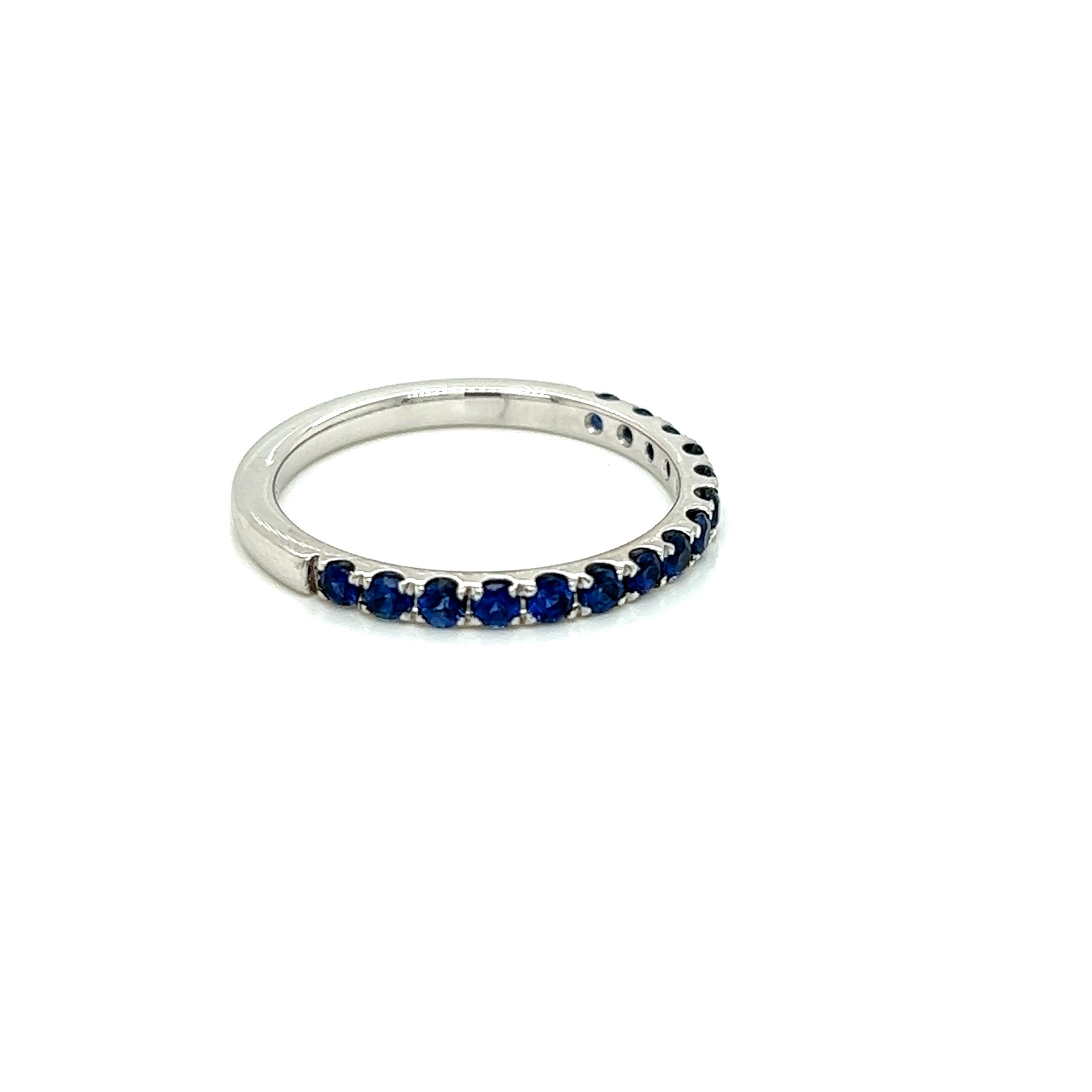 0.24 Carat Round Brilliant Blue Sapphire Band Ring in 18 Karat White Gold.

This timeless band ring features a row of round brilliant blue sapphires weighing 0.24 carats in total. The Sapphires are held in a micro setting on a flawless 18K White