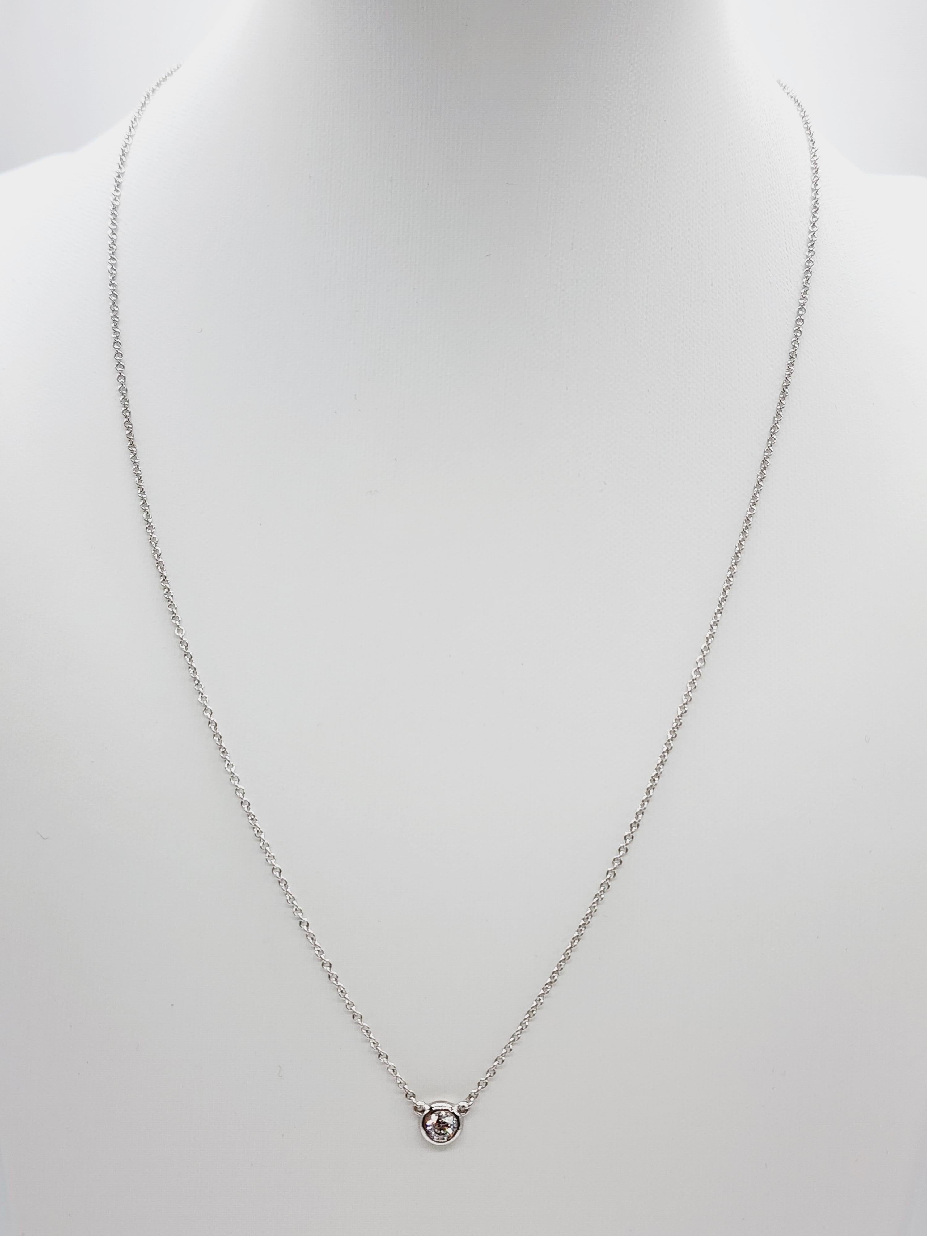 Single Station Diamond by the yard necklace set in Italian made 14K white gold. 
Total weight is 0.24 carats. Beautiful shiny natural diamond. 
Total length is 18 inch. Average Color/Clarity D/VS