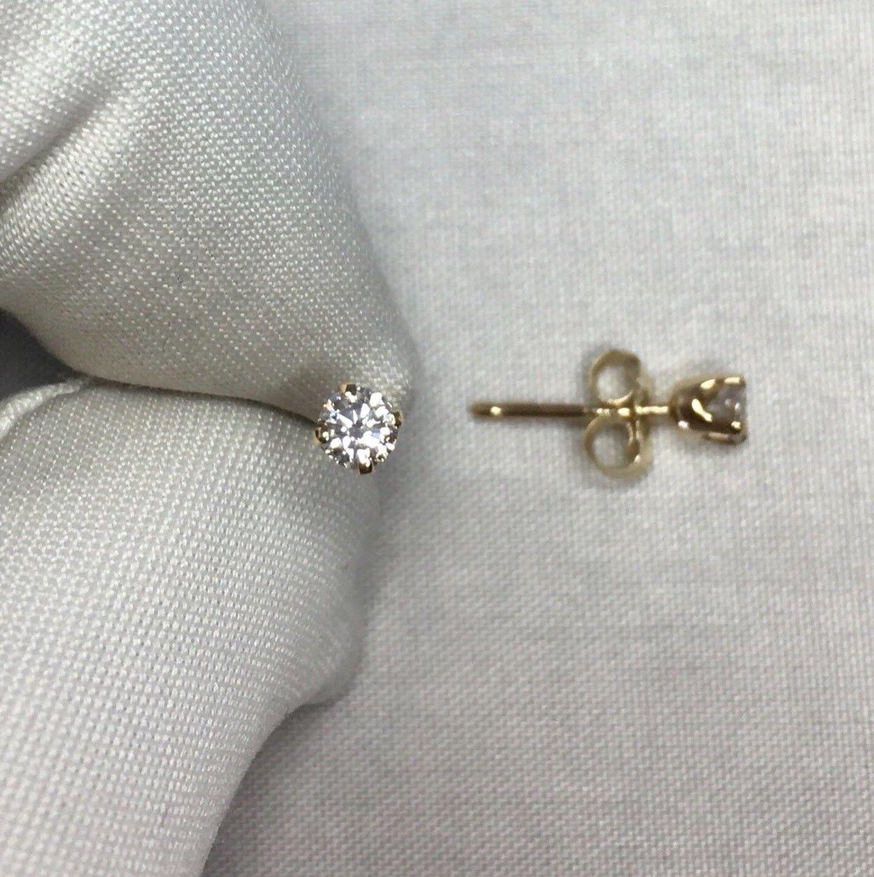 Stunning natural 3mm vivid white diamond earring studs in hallmarked 14k gold. 

0.24 carat matching pair.

F/G colour and VVS2-VS1 clarity.

Both have an excellent round cut and look stunning when the light strikes them. 
These are well matched