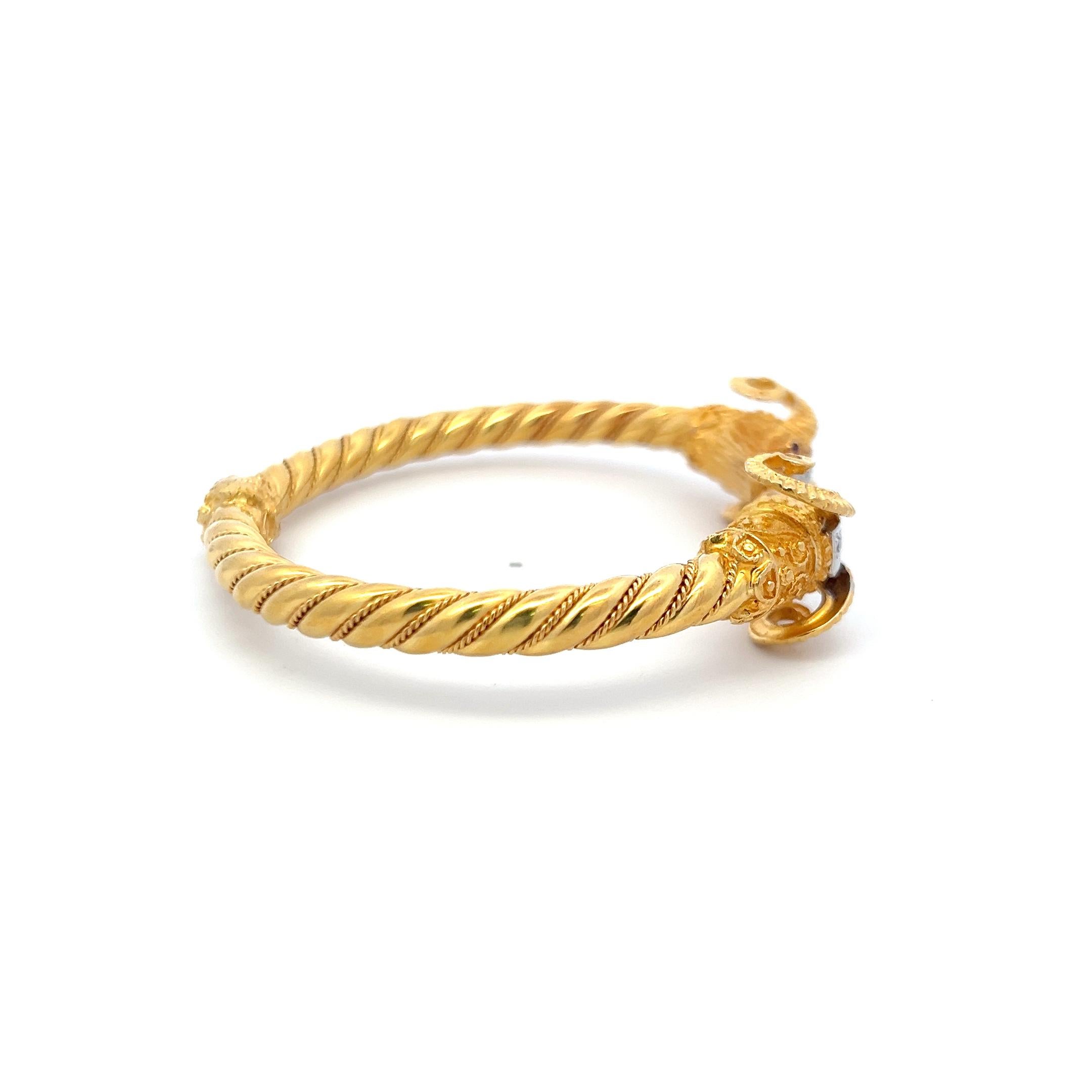 Title:
0.24ct Round Brilliant Diamond Ram Head Bangle Bracelet in 18K Two-Tone Gold (F VS)
Style:
Bangle
Metal:
18 Karat Two Tone Gold
Gemstone 1:
0.24 Carat Diamond
Number of Stones:
8
Color:
F
Clarity:
VS
Shape:
Round