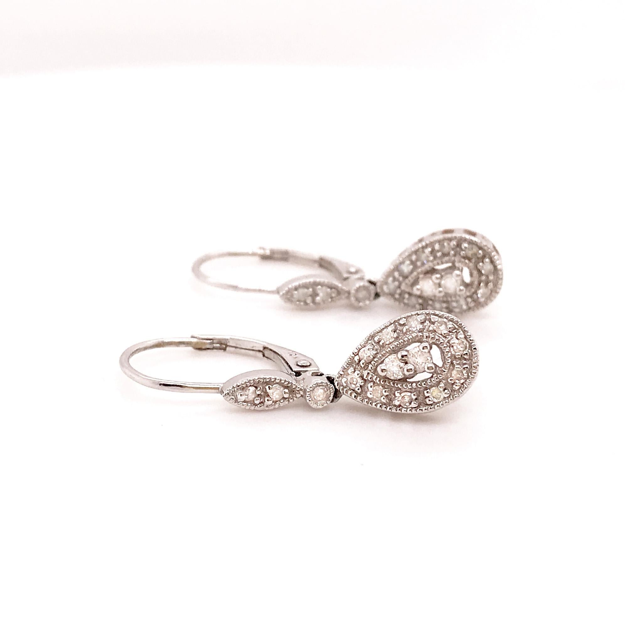 Vintage Diamond Earring Drops/Dangles in White Gold! These pear shaped diamond drops are so classy and bold! The estate earrings are vintage and have a timeless, classic look. With genuine round diamonds set in a pear shaped formation these earrings