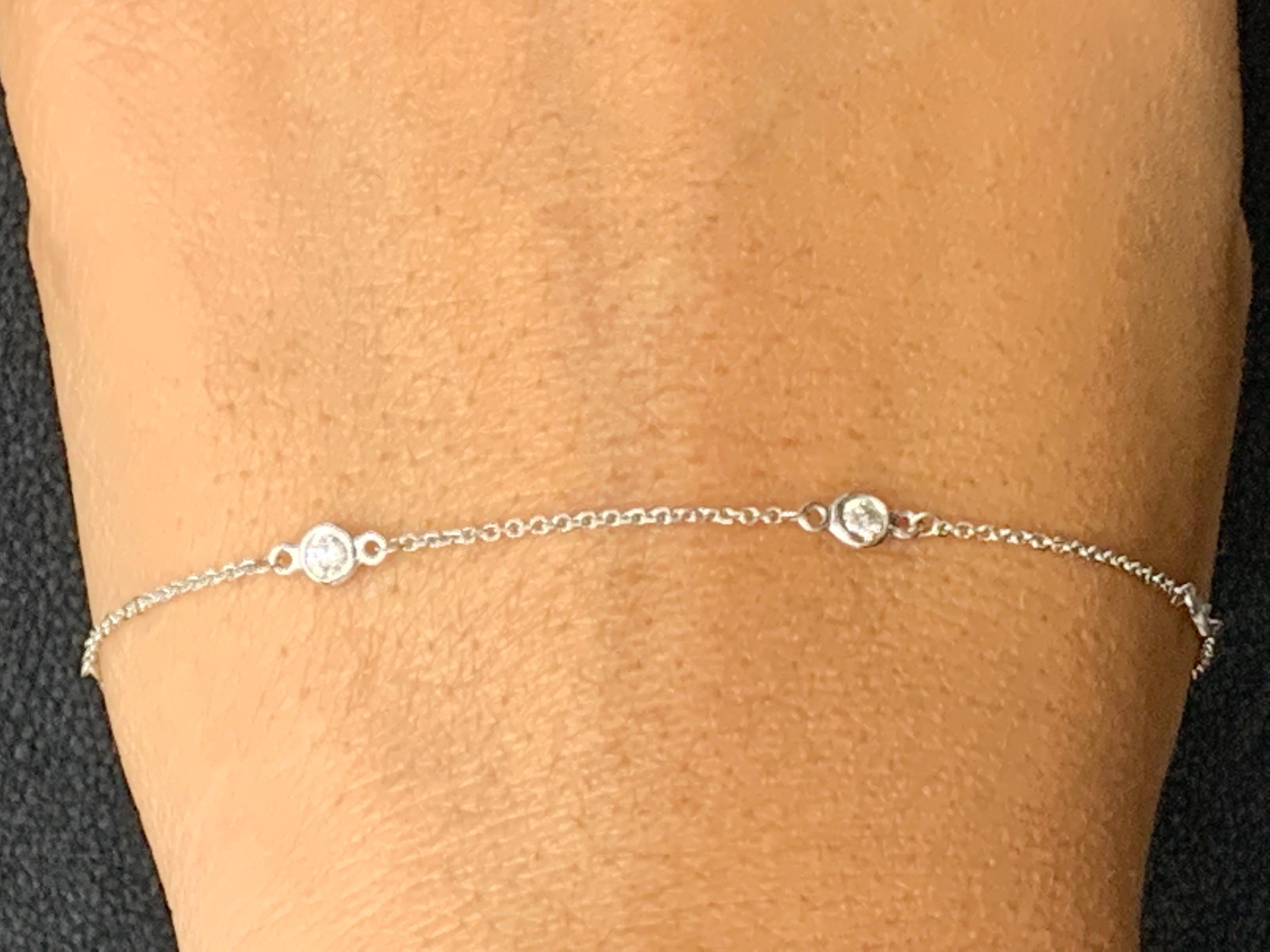 A modern 7-inch Diamond by the Yard bracelet showcasing five round diamond bezel set in 14 karats white gold. Diamonds weigh 0.25 carats in total.

Style available in different price ranges. Prices are based on your selection of the 4C’s (Carat,