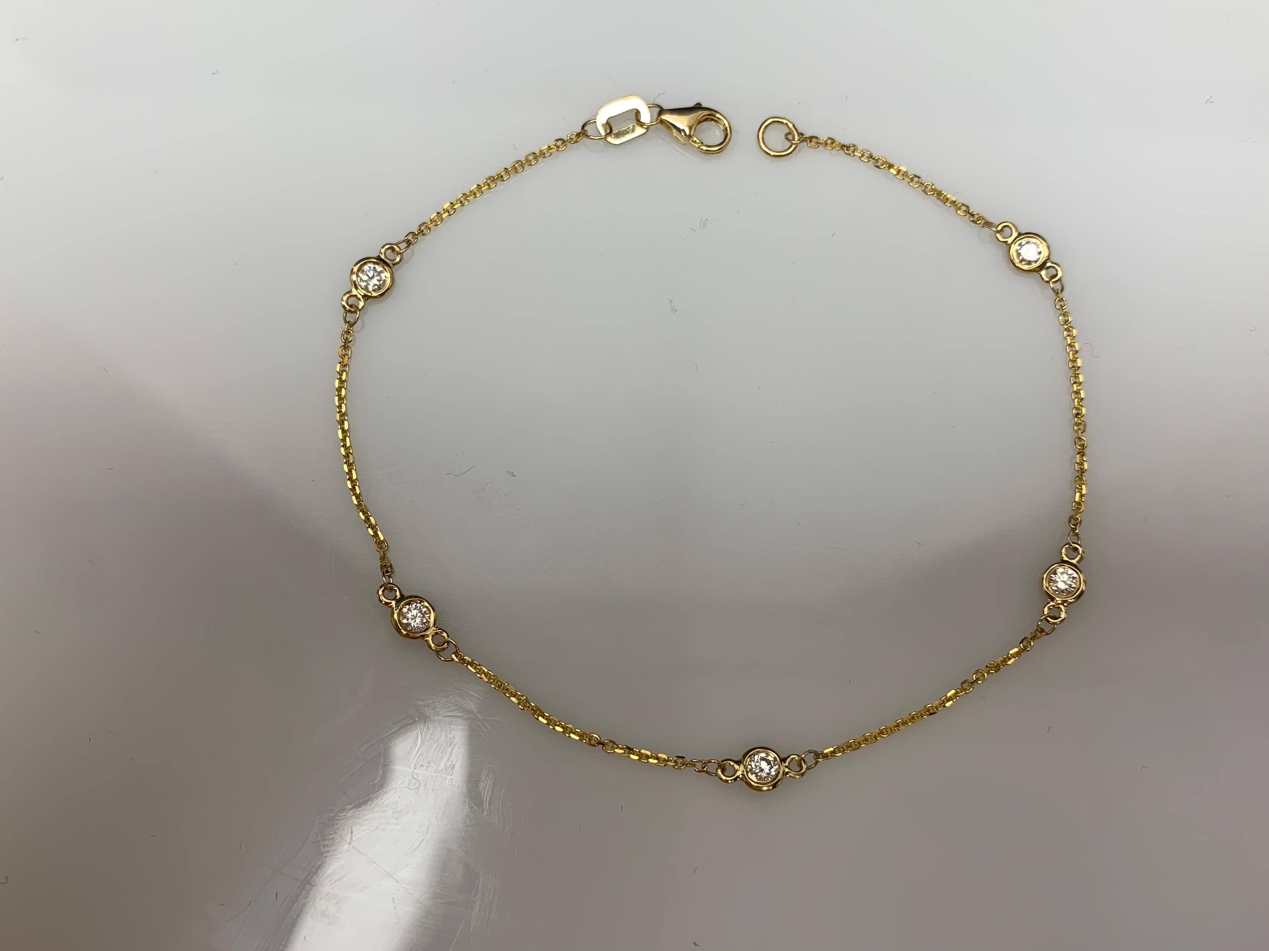 A modern 7-inch Diamond by the Yard bracelet showcasing five round diamond bezel set in 14 karats yellow gold. Diamonds weigh 0.25 carats in total.

Style available in different price ranges. Prices are based on your selection of the 4C’s (Carat,
