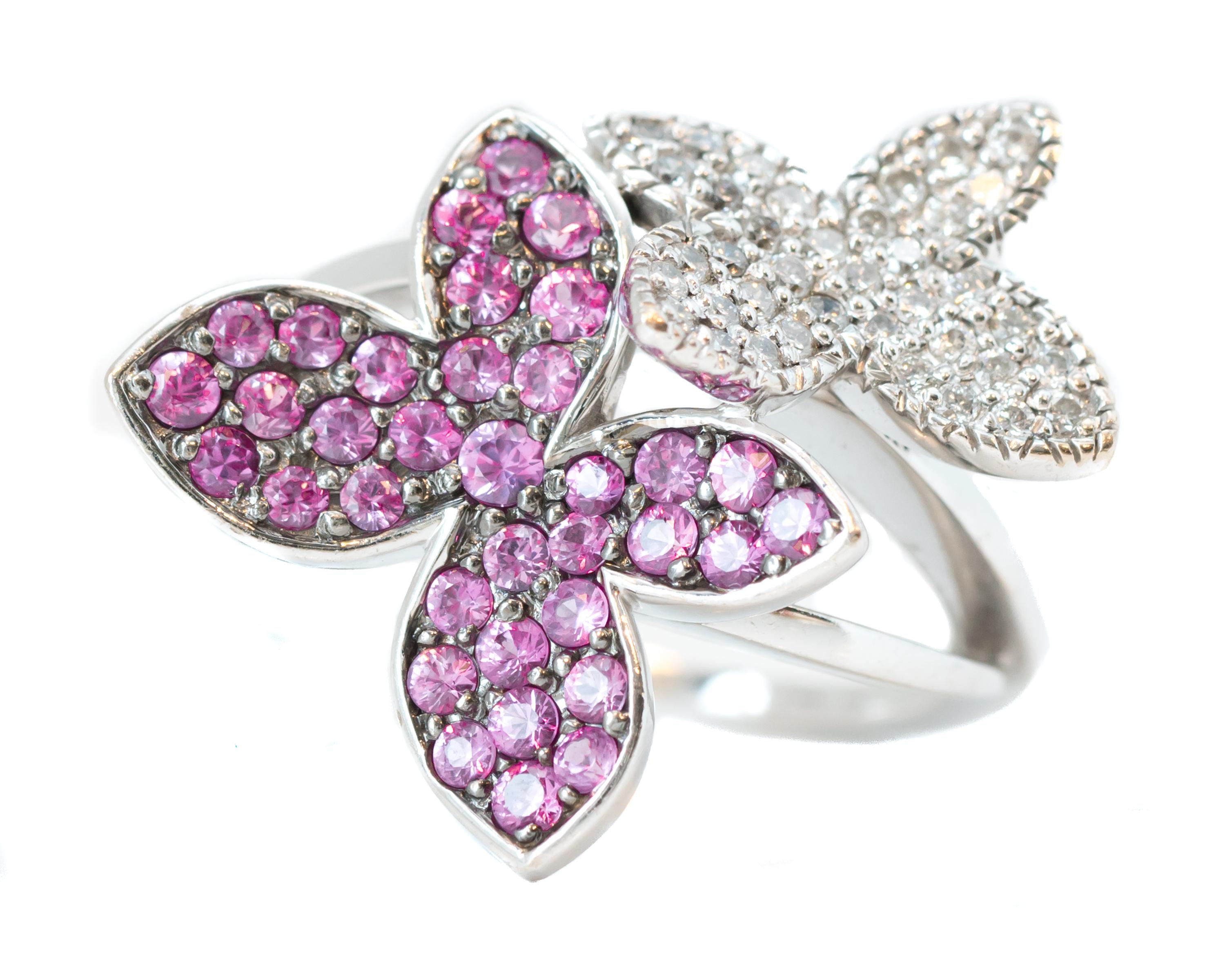 Features:
0.25 carat total Round Brilliant Diamonds and 0.25 carat total Round Pink Sapphires in a gorgeous floral design crafted in 14 karat White Gold
The ring has a modified bypass 2-flower design with open shoulders 


Ring Details:
Size: 7.75,