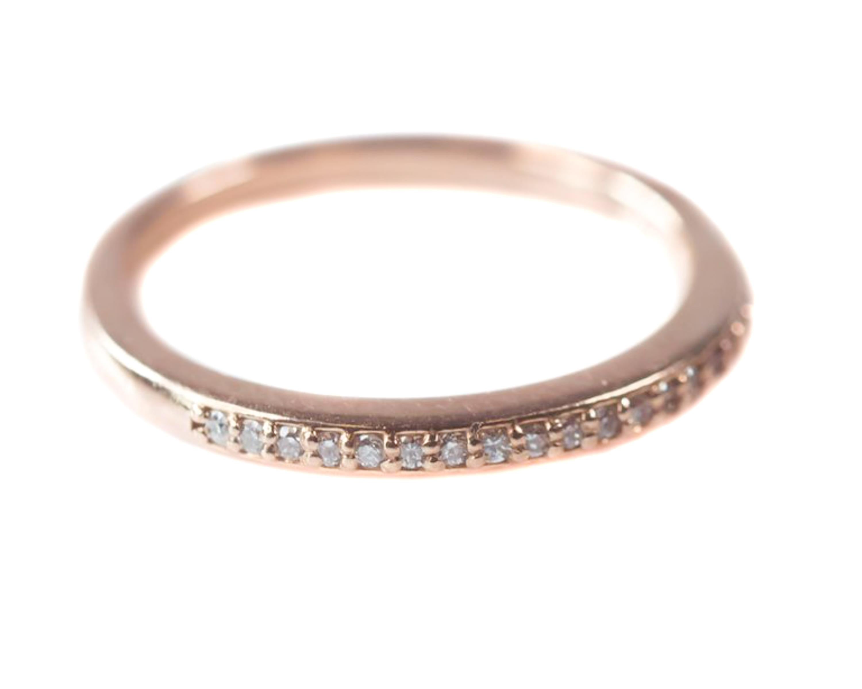 14 Karat Rose Gold and 0.25 carat total weight Diamond Eternity Band - Halfway around eternity band

Features 0.25 cttw Round Brilliant Diamonds prong set in 14K Rose Gold. The front half of the ring is covered in Diamonds. The back half of the ring
