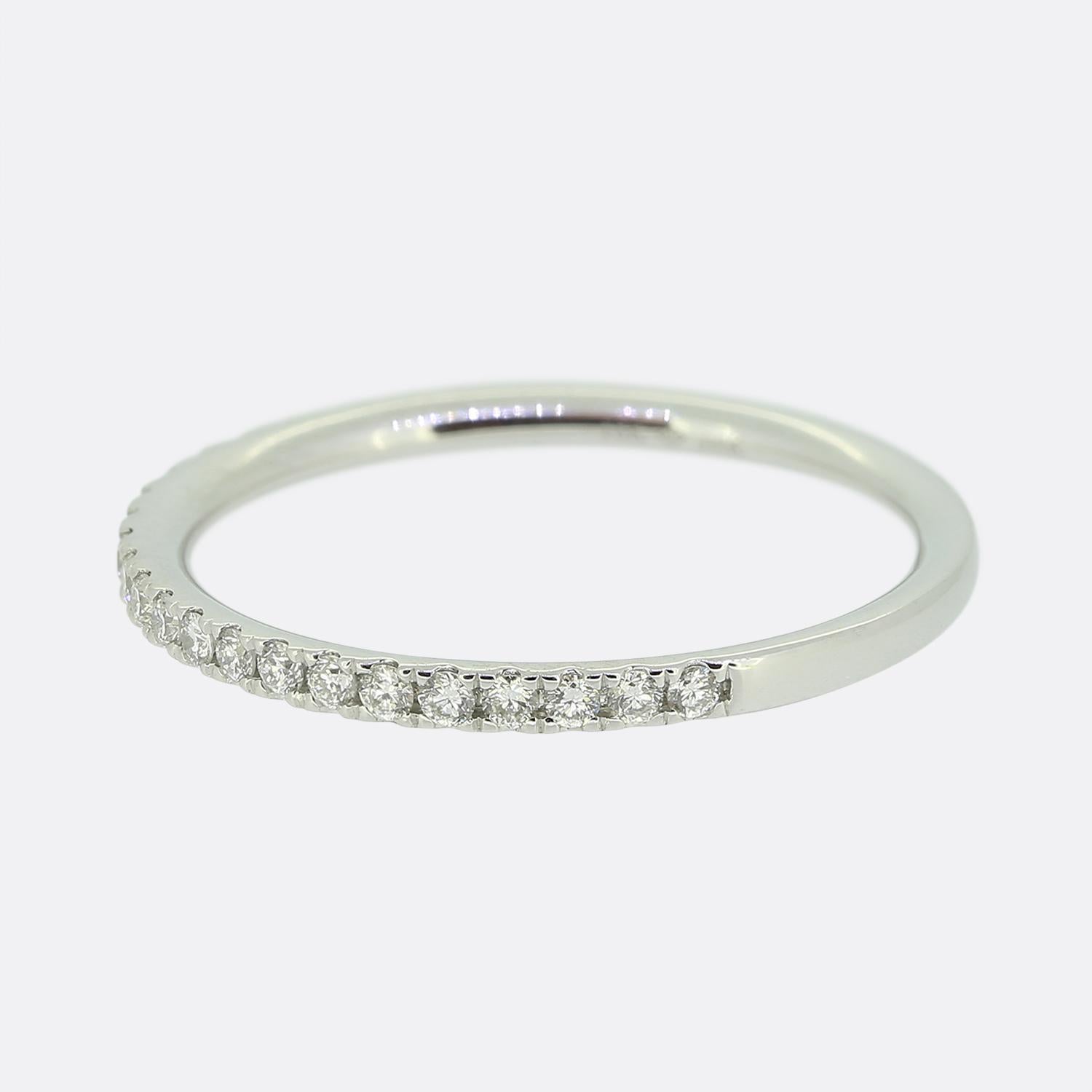 This is an 18ct white gold diamond half eternity ring. The ring features 23 claw set round brilliant cut diamonds.

Condition: Used (Excellent) - Professionally polished to appear brand new
Weight: 1.4 grams
Size: L (52)
Band Width: 1.5mm
Total