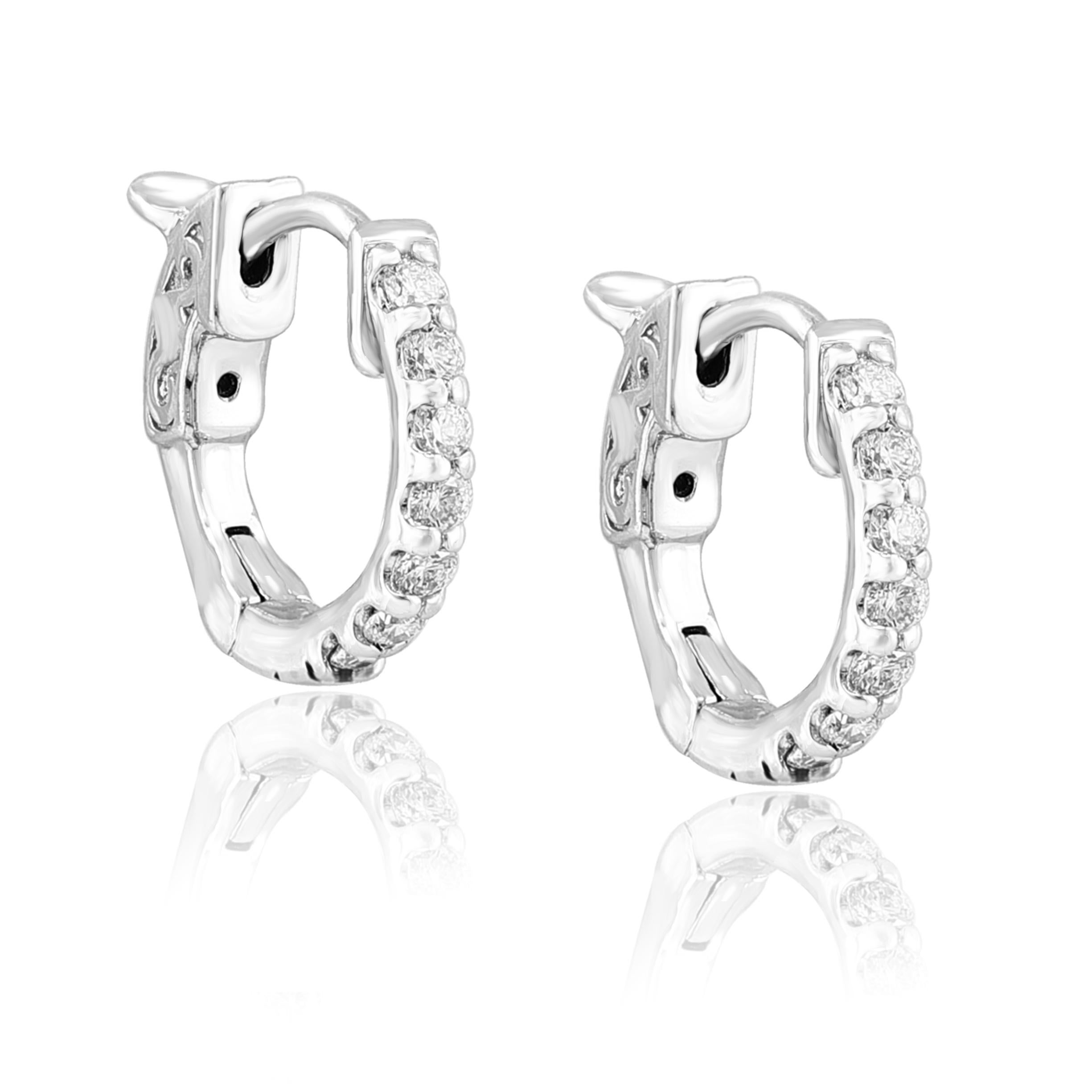 A chic and fashionable pair of hoop earrings showcasing  round diamonds, set in 14k white gold.  14 Round diamonds weigh 0.25 carats total. A beautiful piece of jewelry.


All diamonds are GH color SI1 Clarity.
Style available in different price
