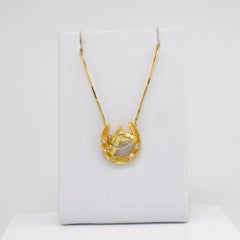 Diamond Horseshoe Pendant Necklace 18 Karat Gold with Split Chain circa 1970s