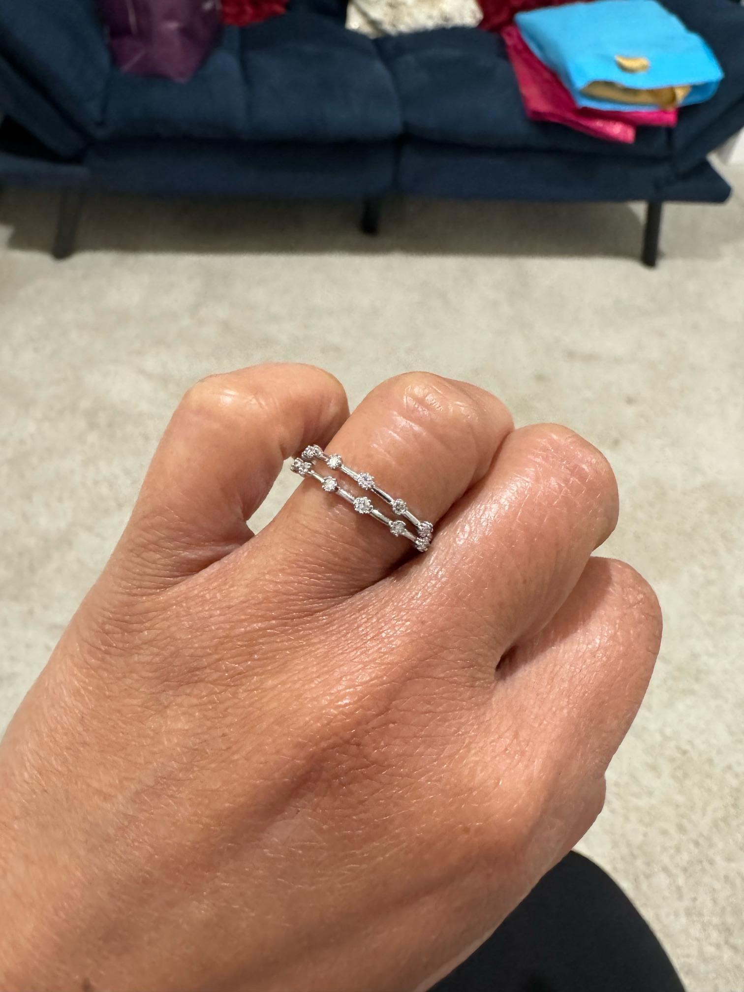 0.25 Carat Diamond Set of 2 White Gold Bands

These 2 bands have a total of 12 Round Cut Diamonds that weigh 0.25 carats.  Clarity is SI2 and Color is F
Curated in 14K White gold	
These are great to stack between other bands and rings or wear by