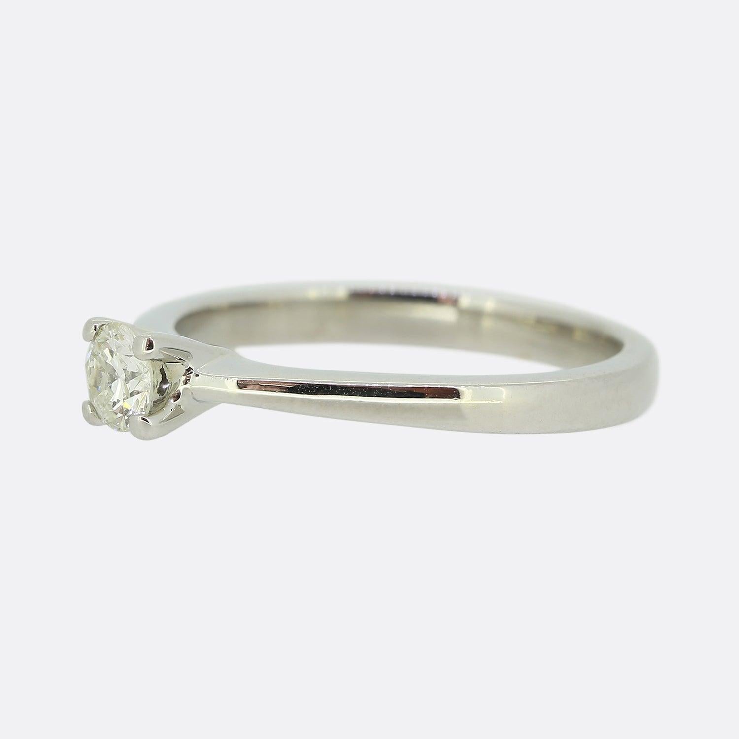 Here we have a wonderfully simple diamond solitaire ring. This classic style engagement ring has been crafted from platinum and is set with a single round brilliant cut diamond within a four clawed mount.

Condition: Used (Very Good)
Weight: 3.7