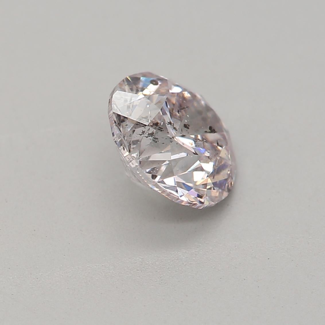 Women's or Men's 0.70 Carat Very Light Pink Round cut diamond I1 Clarity GIA Certified For Sale