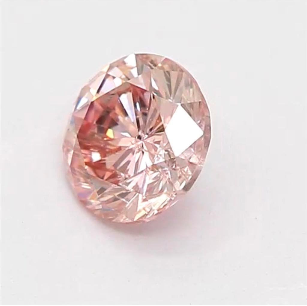 Women's or Men's 0.25 Carat Fancy Orangy Pink Round Shaped Diamond I1 Clarity CGL Certified For Sale
