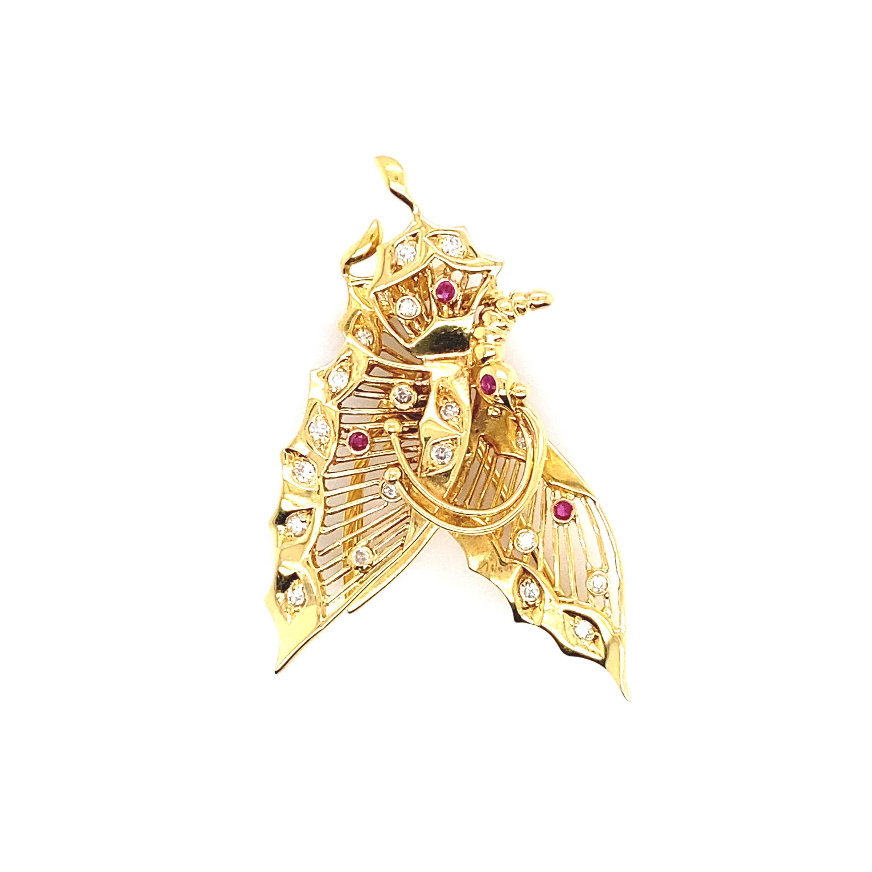 A beautiful Brooch/Pendant set in 18K Yellow Gold featuring 0.25 Carats Natural Diamonds, 0.08 Carats Rubies. Rubies are referred to as 