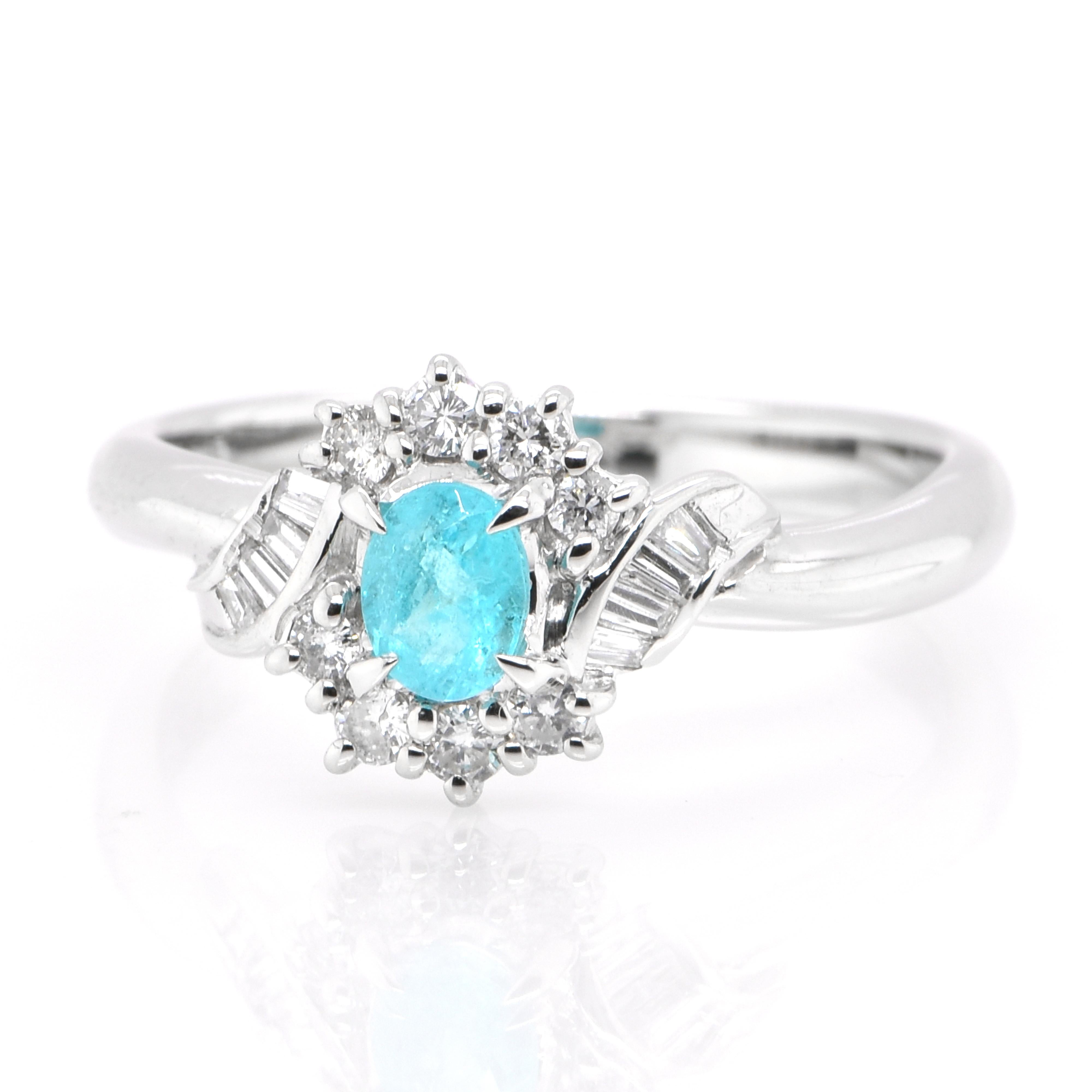 A beautiful ring featuring a 0.254 Carat Natural Brazilian Paraiba Tourmaline and 0.23 Carats of Diamond Accents set in Platinum. Paraiba Tourmalines were only discovered 30 years ago in the Brazilian state of the same name- Paraiba. Since then they