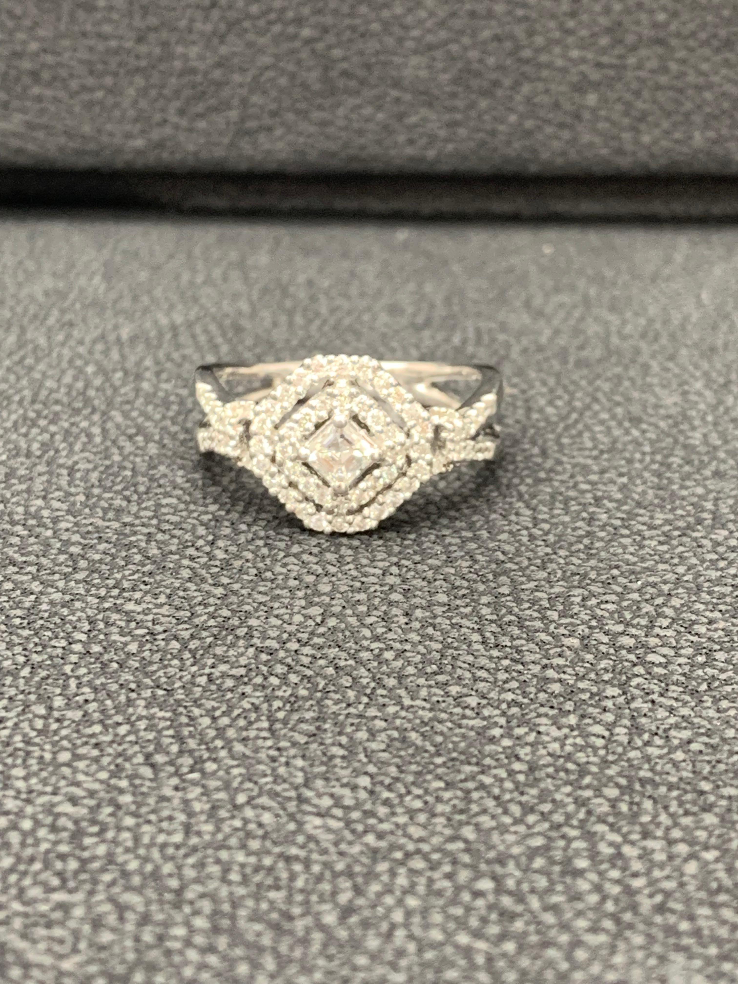 A stylish cocktail ring showcasing open work design made in 18 karat white gold. Princess cut center diamond weigh 0.25 carats. All other brilliant round diamond weigh 0.36 carat in total.

Size 6.5 US (Sizable). One of a Kind  piece.
All diamonds