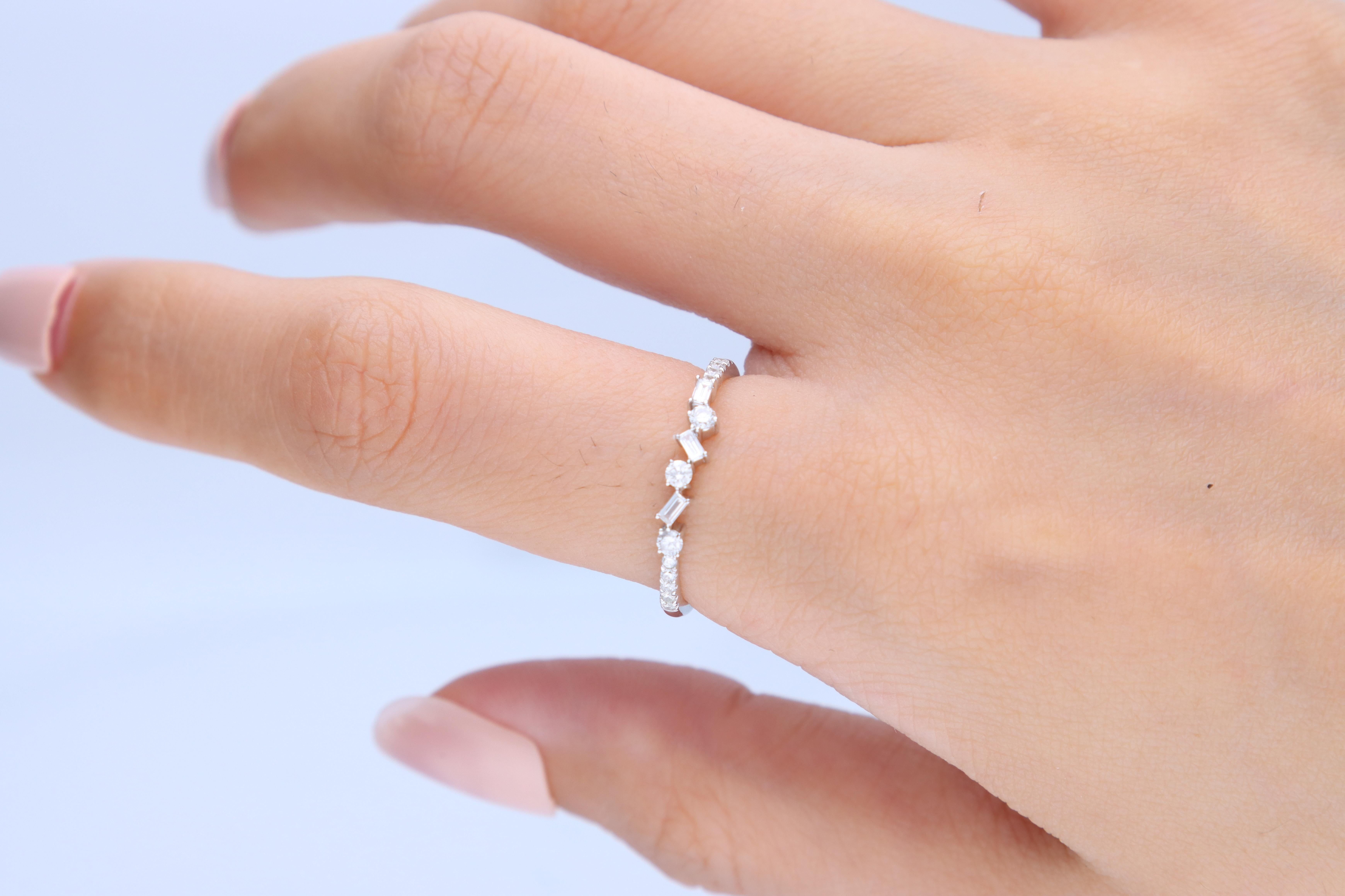 Stunning, timeless and classy eternity Unique ring. Decorate yourself in luxury with this Gin & Grace ring. The 14k White Gold jewelry boasts Round-Cut Diamond (13 pcs) 0.18 Carat, Baguette-cut Diamond (3 pcs) 0.06 carat accent stones for a lovely