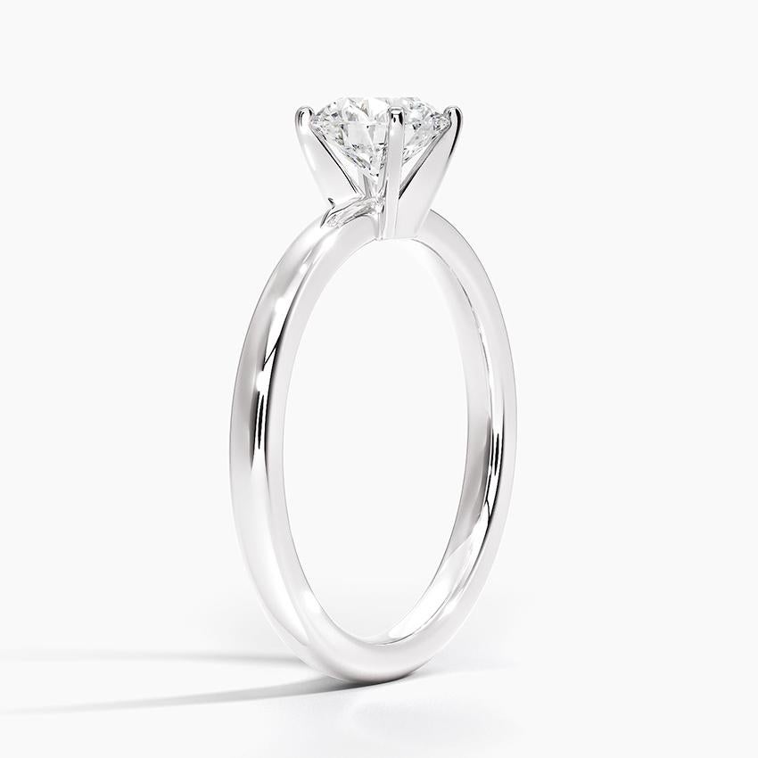 Featuring the classic solitaire engagement ring is a timelessly popular style. Without accents on the setting, a solitaire ring is the perfect choice to showcase a single center diamond. The color of the diamond is I-J and the clarity is SI.