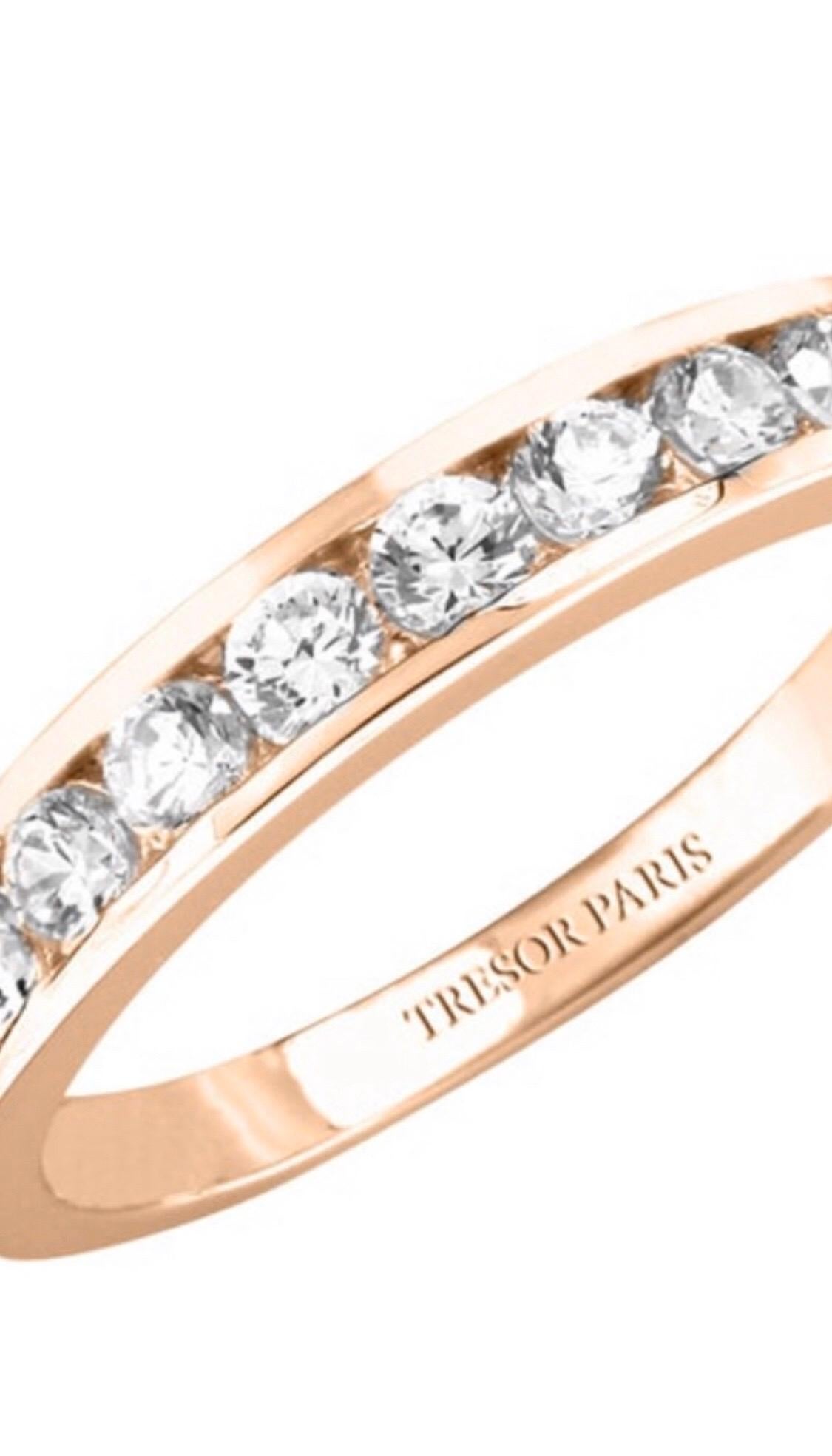 This Channel Set 18 Karat Rose Gold half Eternity ring is an exquisite addition to our collection. A sparkling array of nine H-SI1 Round Brilliant Diamonds for a classic and iconic look. This ring has a total Diamond weight of 0.25 Carats, the