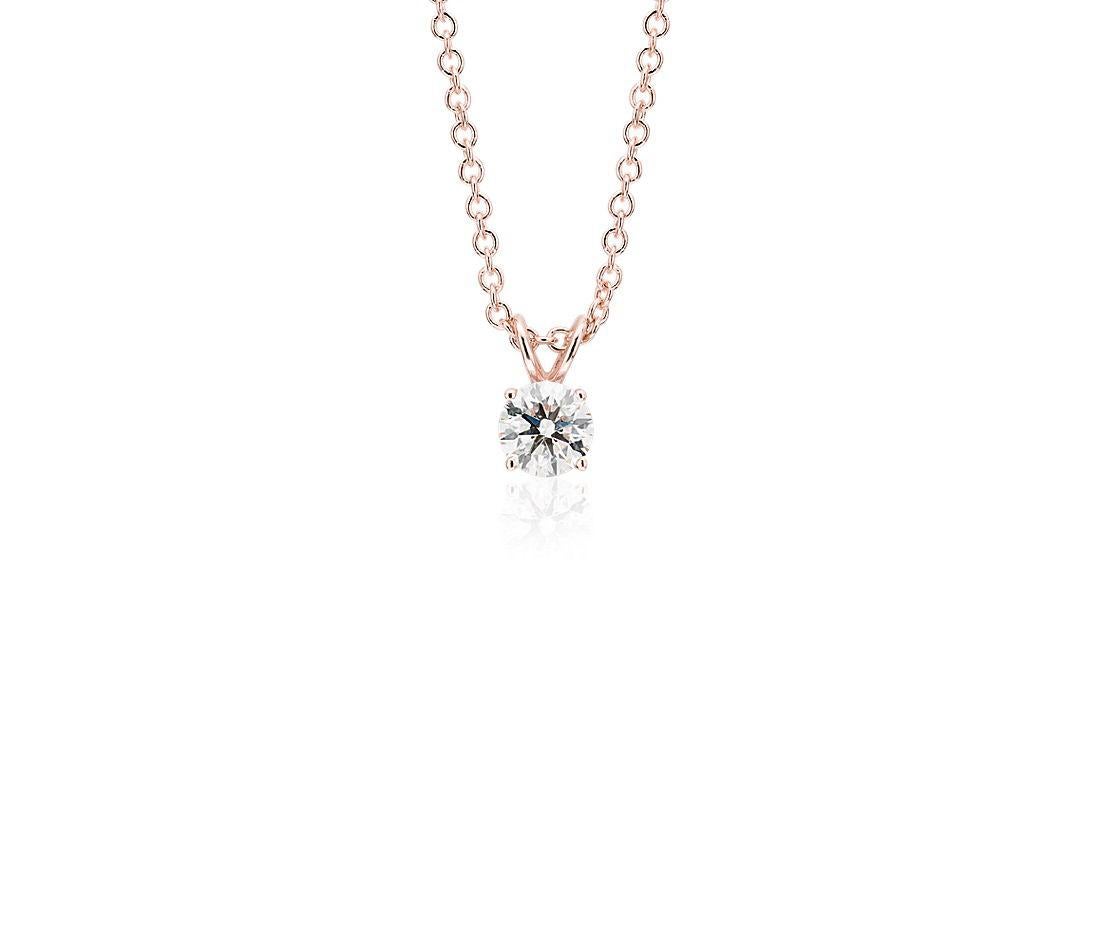 This impressive diamond solitaire pendant is finely crafted in brightly polished 14 karat rose gold and features a round shaped 0.25 carat diamond that has I1 clarity, gracefully prong set on a shiny split bail. Ideal as an anniversary or birthday
