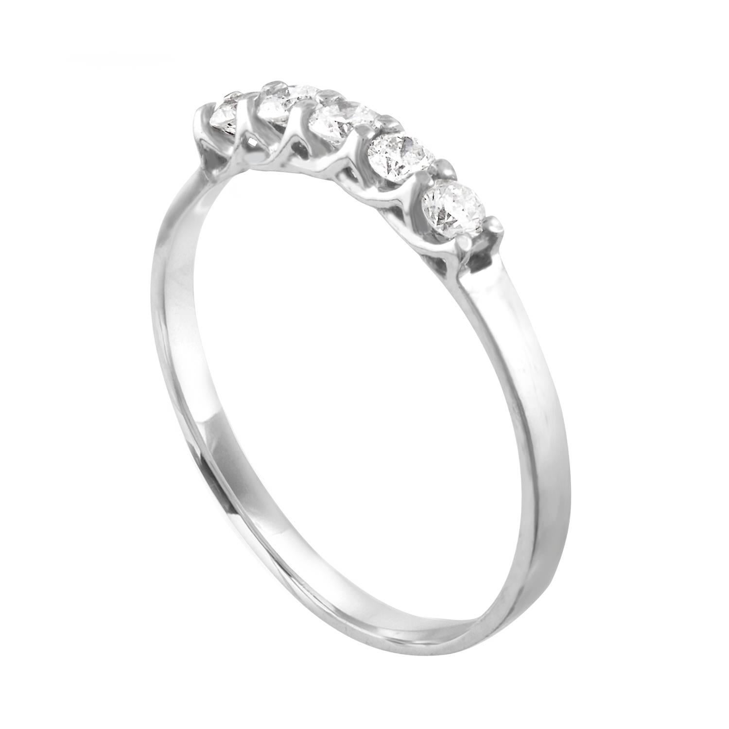 Delicate Five-Stone Ring Great For Stacking
The ring is 14K White Gold
There are 0.25 Carats in Diamonds H I3
The ring is a size 6, sizable
The ring weighs 1.2 grams