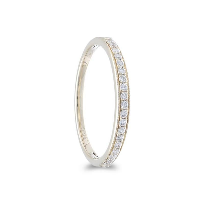 Diamonds: Nineteen meticulously selected excellent round diamonds grace this wedding ring, each set securely in a delicate micro pave setting, creating a continuous and delicate shimmer. The total carat weight of 0.25 carats ensures a captivating