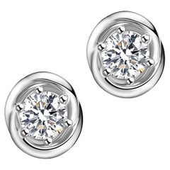 Clous d'oreilles Aurora en or blanc 18 carats avec halo de diamants 0,25 carat