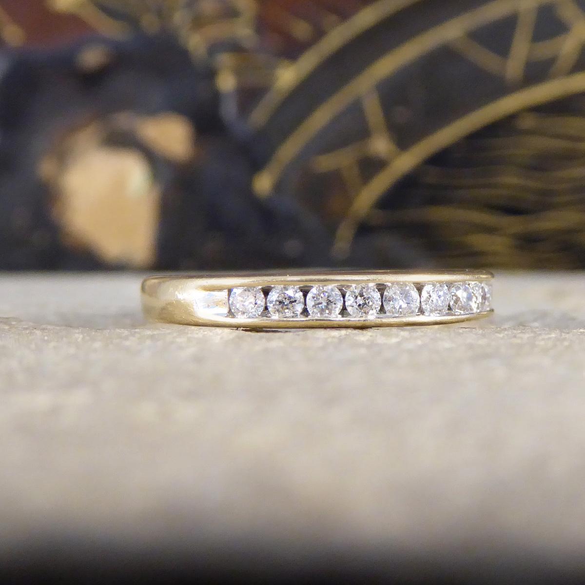 A classic and gorgeous stackable ring. Featuring in this half eternity ring are 11 Diamonds channel set around the full head around allowing it to sparkle from every angle with a total of 0.25ct and laser marked with the Diamond weight on the inner