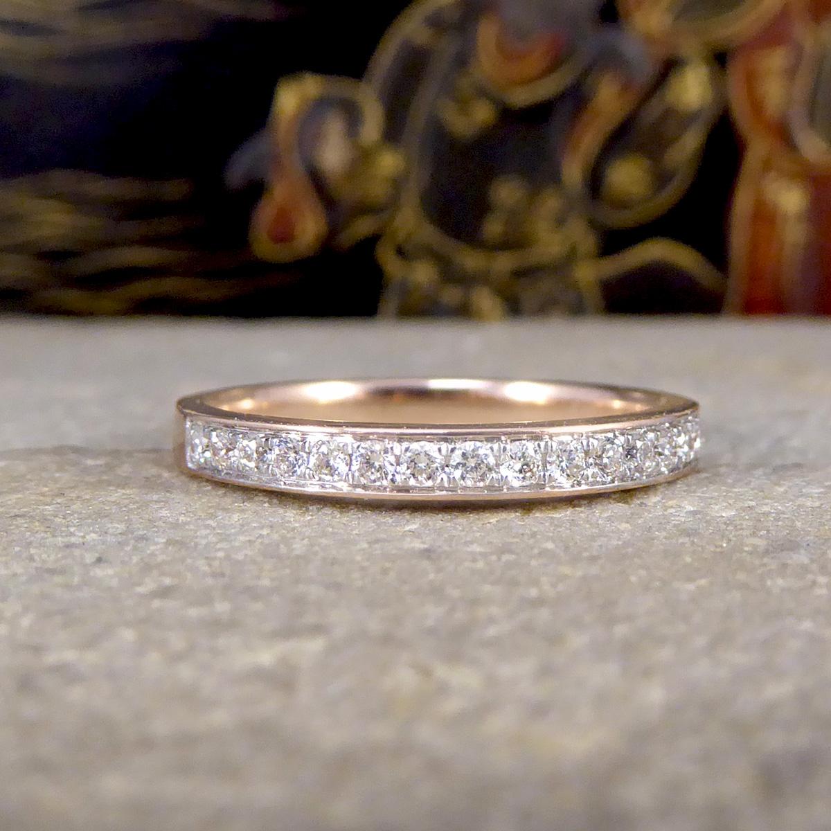 A classic and gorgeous stackable ring. Featuring in this half eternity ring are 20 Diamonds channel set around the full head around allowing it to sparkle from every angle with a total of 0.25ct. The Diamonds are sat on a Rhodium plated channel to