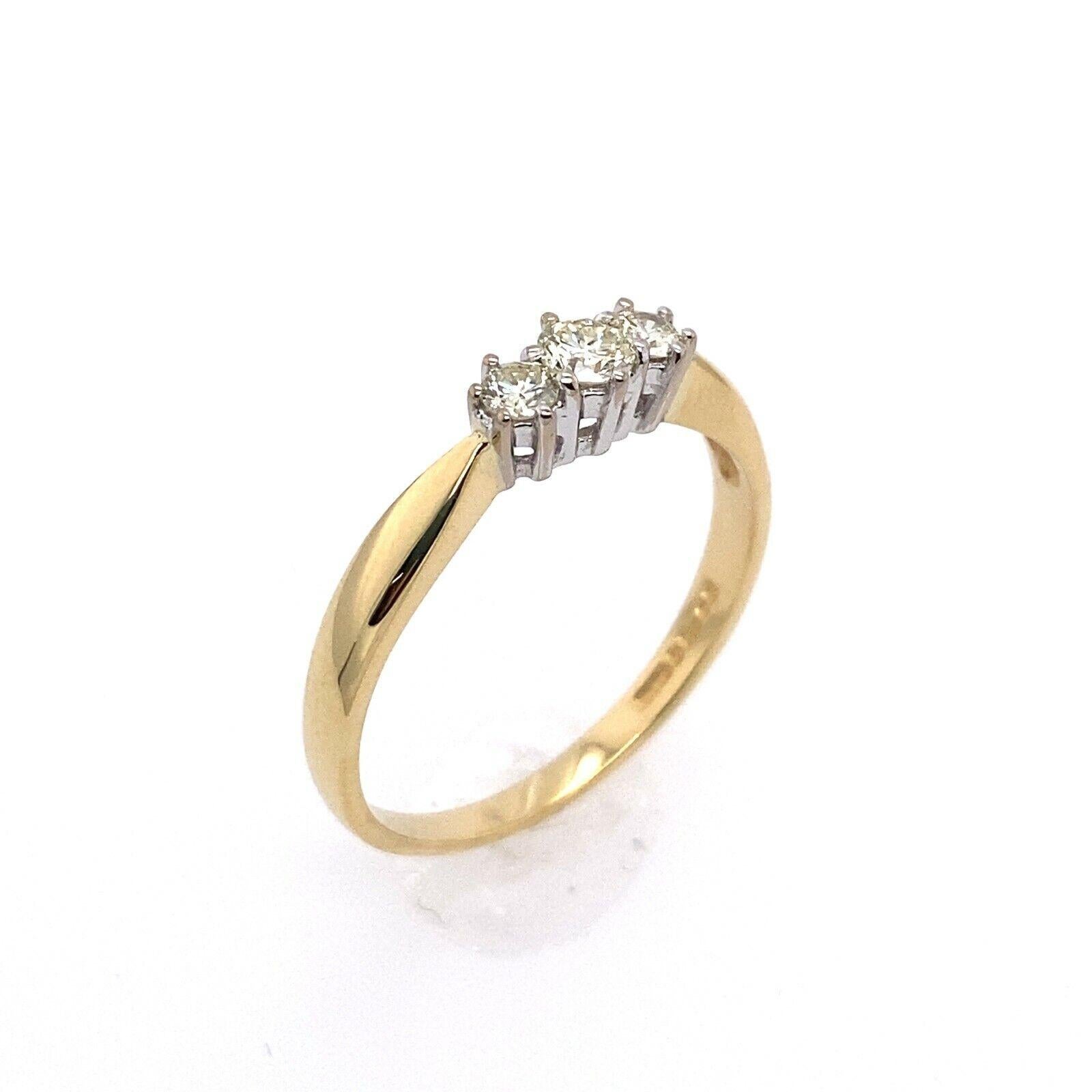 Classic 18ct Yellow& White Gold Trilogy Ring, Set With 0.25ct Of Diamonds

Additional Information: 
Total Diamond Weight: 0.25ct
Diamond Colour: G/H
Diamond Clarity: SI
Width of Band : 1.80mm
Width of Head: 3.80mm
Length of Head: 8.75mm
Total