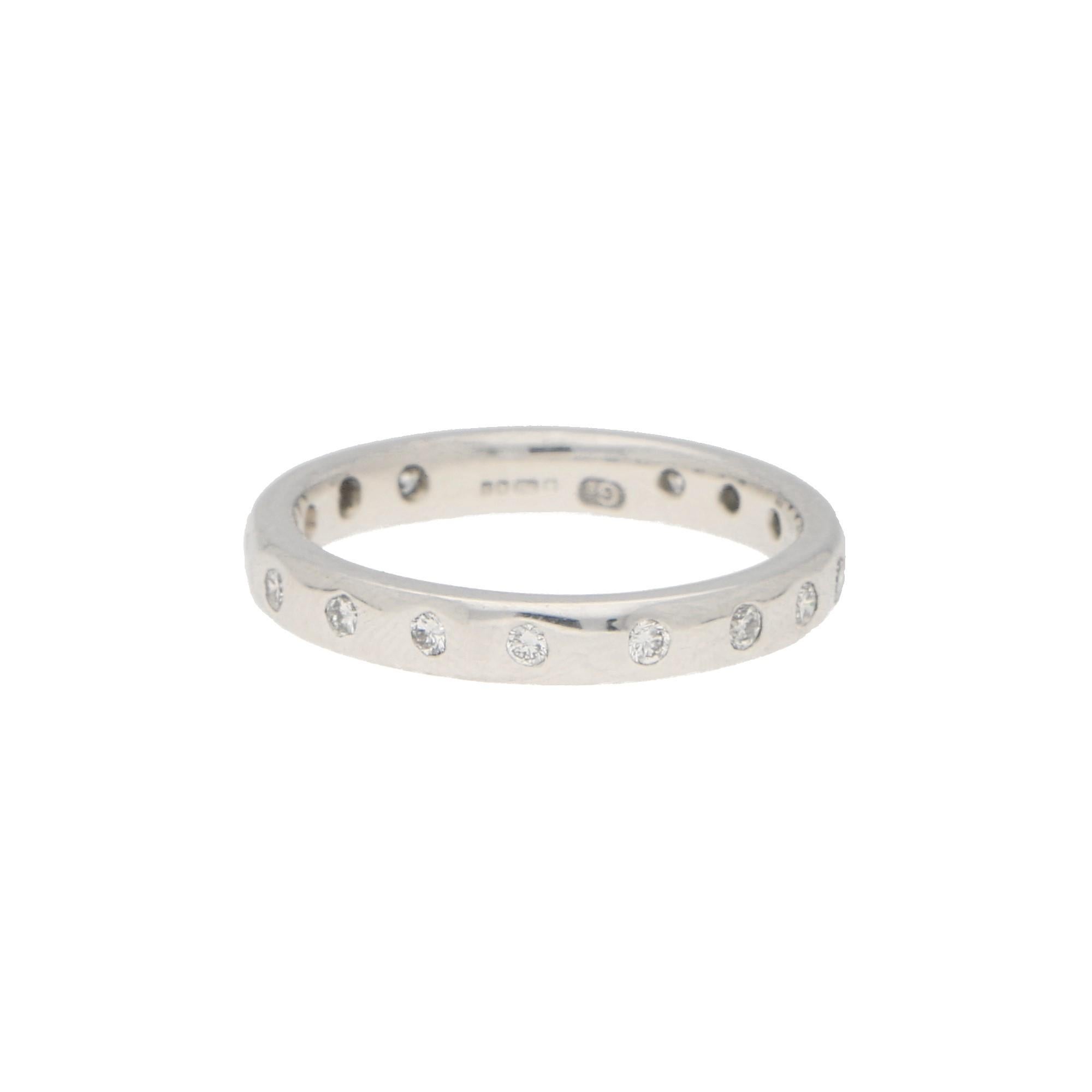 A beautiful diamond full eternity ring set in 18k white gold. 

The ring is composed of 16 round brilliant cut diamonds perfectly rubover set within a 3mm white gold band.

Total diamond weight is approximately 0.25 carats, estimated as G/H in