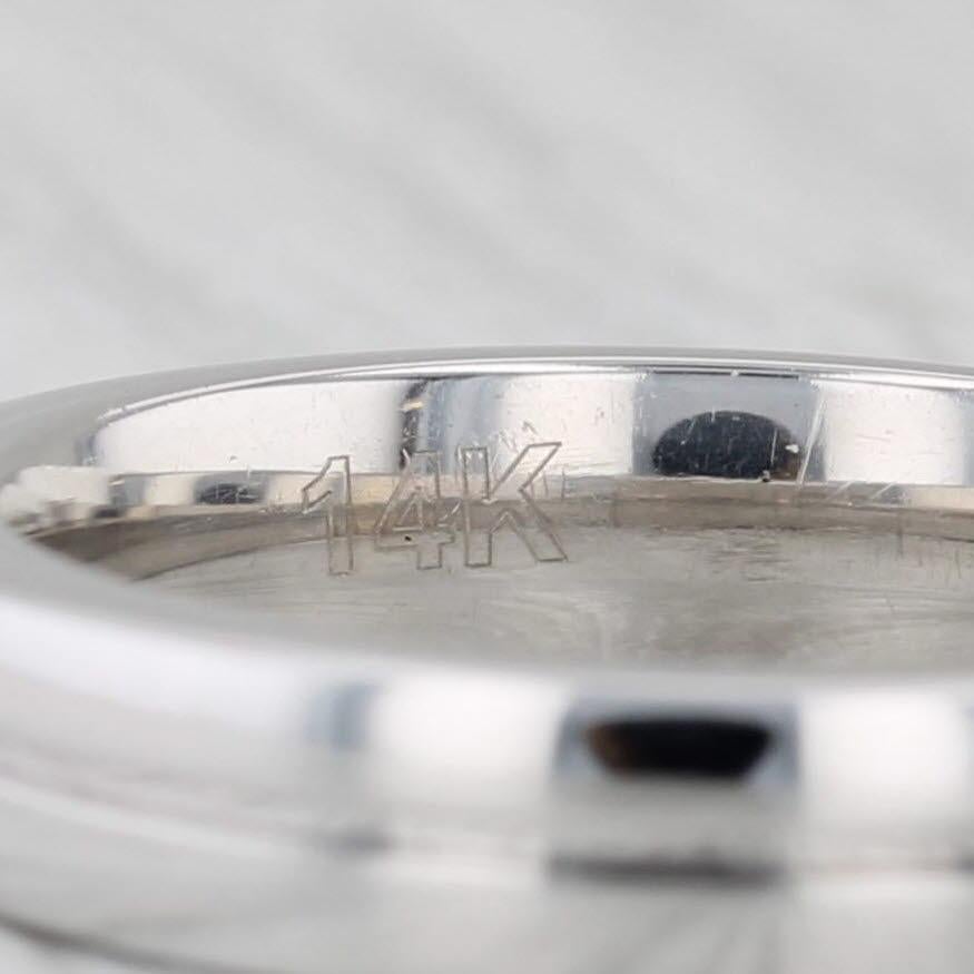 Gemstone Information:
- Natural Diamond -
Carats - 0.25ct 
Cut - Round Brilliant
Color - H - I
Clarity - I1

Metal: 14k White Gold
Weight: 4.9 Grams 
Stamps: 14k
Rise Above Finger: 2.5 mm
Band / Shank Width: 4.1 mm

This ring is a size 6 1/4 - 6