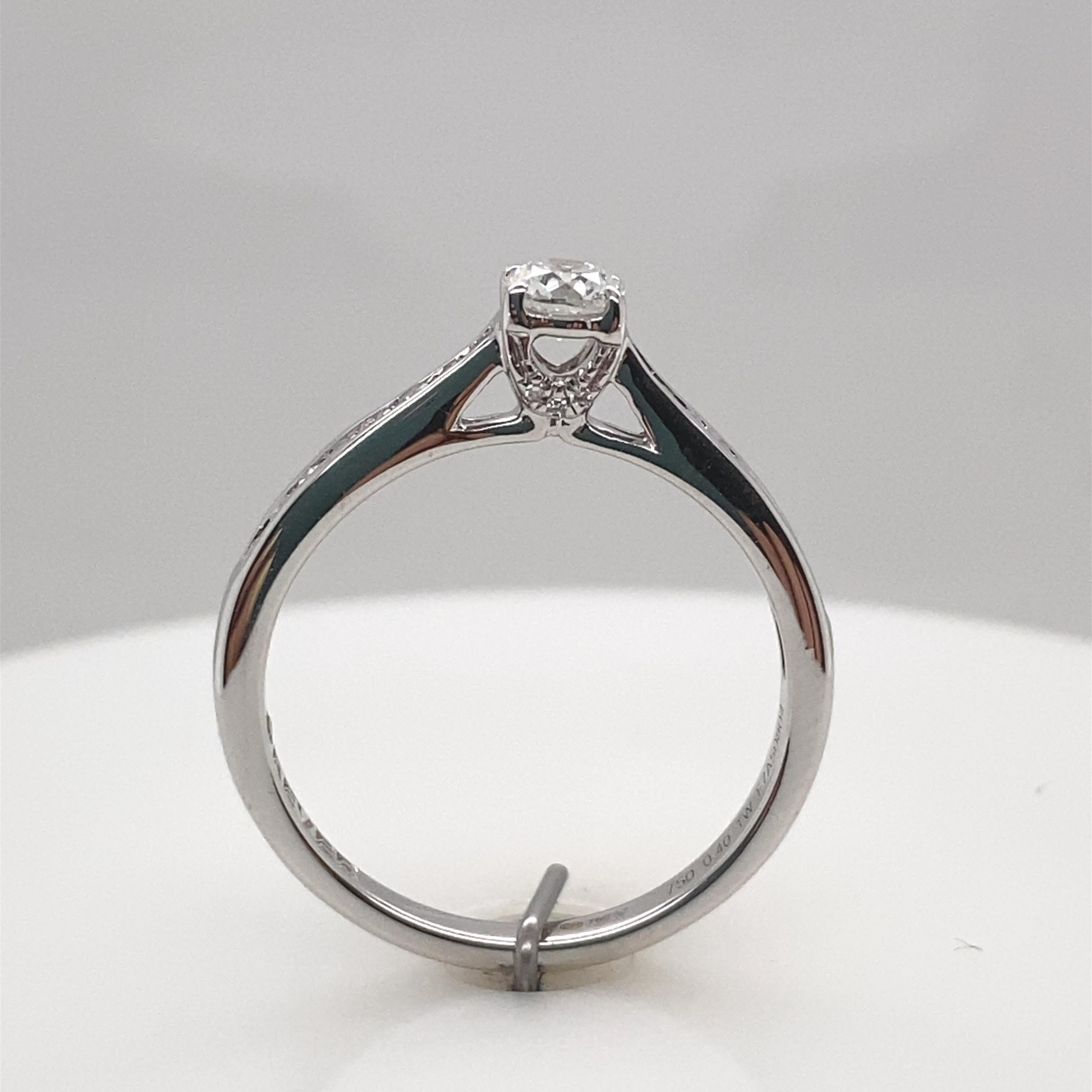 Bague solitaire avec diamant certifié IGI de 0,25 carat en or blanc 18 carats en vente 1