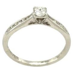 Bague solitaire avec diamant certifié IGI de 0,25 carat en or blanc 18 carats