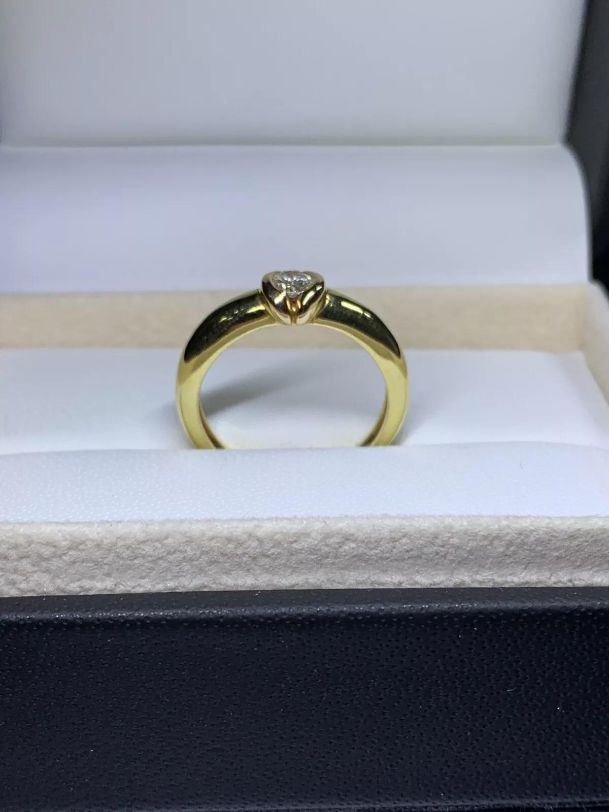 Femenino o masculino 0,25 ct Anillo de compromiso de diamante redondo en oro amarillo de 18 quilates en venta