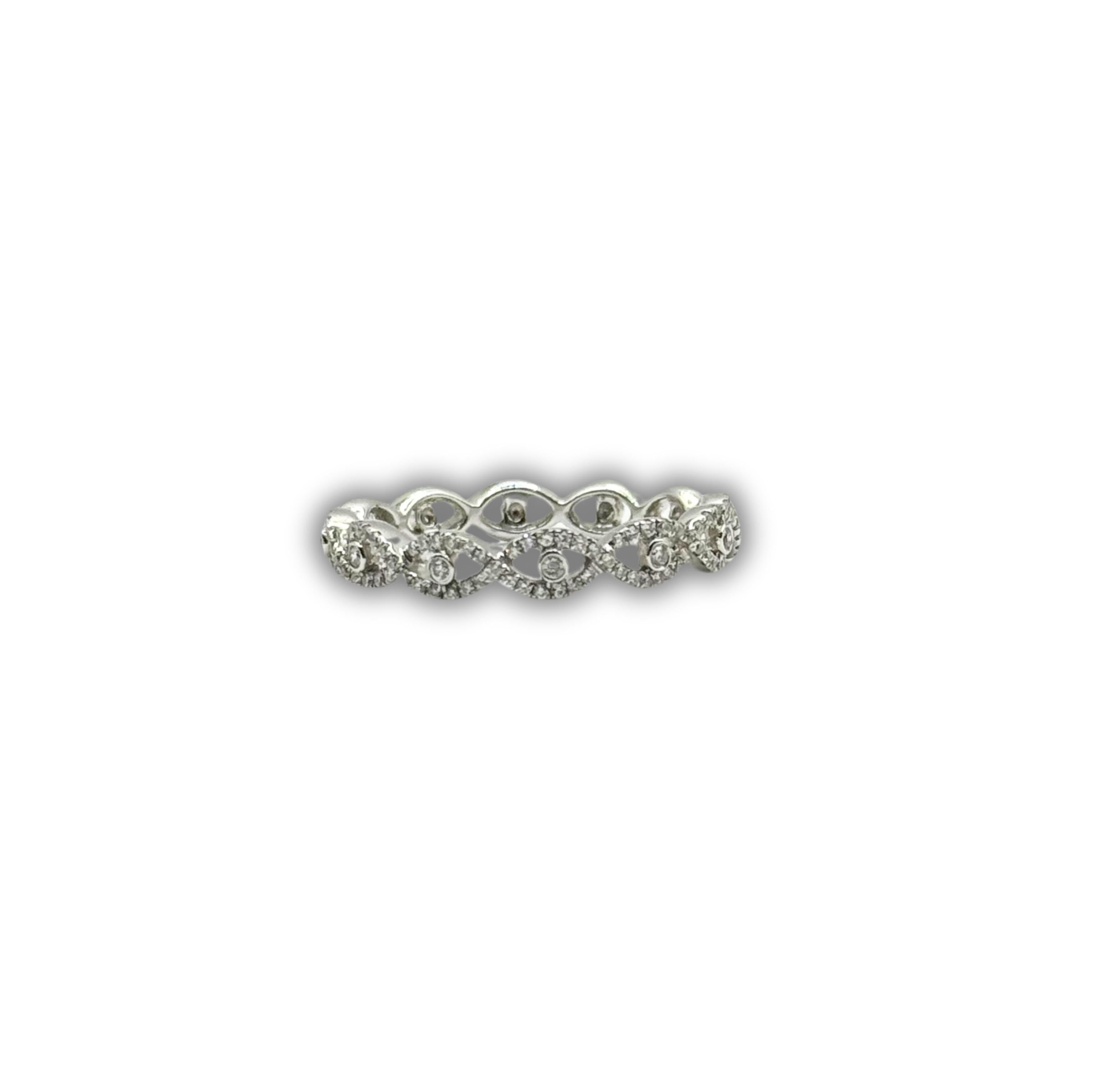 Designer: SES Creations
Metal: 18KT White Gold
Stone Type: Natural Diamonds
Stone Shape: Round
Carat Weight: 0.25ctw
Band Width: 4.5mm wide
Details: Natural diamonds extend halfway around the finger