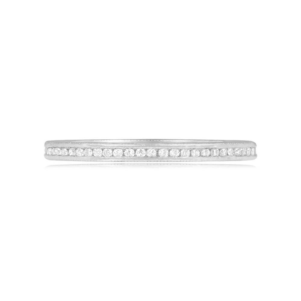 This exquisite wedding band is a true embodiment of elegance, showcasing a continuous eternity of channel-set single-cut diamonds that encircle the entire band. Each diamond has been carefully selected to ensure a perfect harmony in both size and