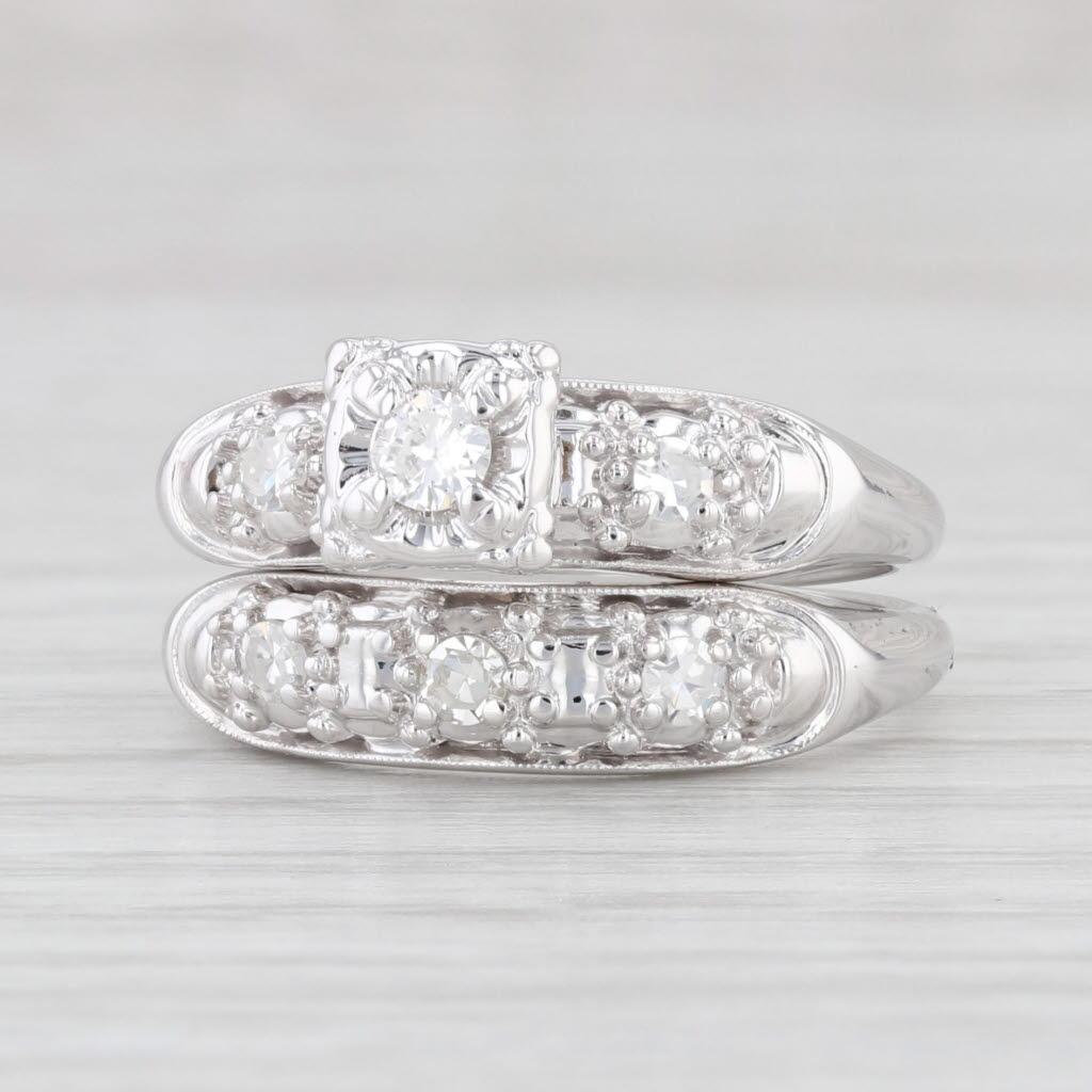 Gemstone Information: Natural Diamonds - 0.25ctw Total Carats
- Engagement -
- Center:
Carats - 0.09ct
Cut - Round Brilliant
Color - F
Clarity - VS2
- Accents:
Total Carats - 0.06ctw
Cut - Single
Color - G - H
Clarity - VS2

- Wedding -
Total Carats