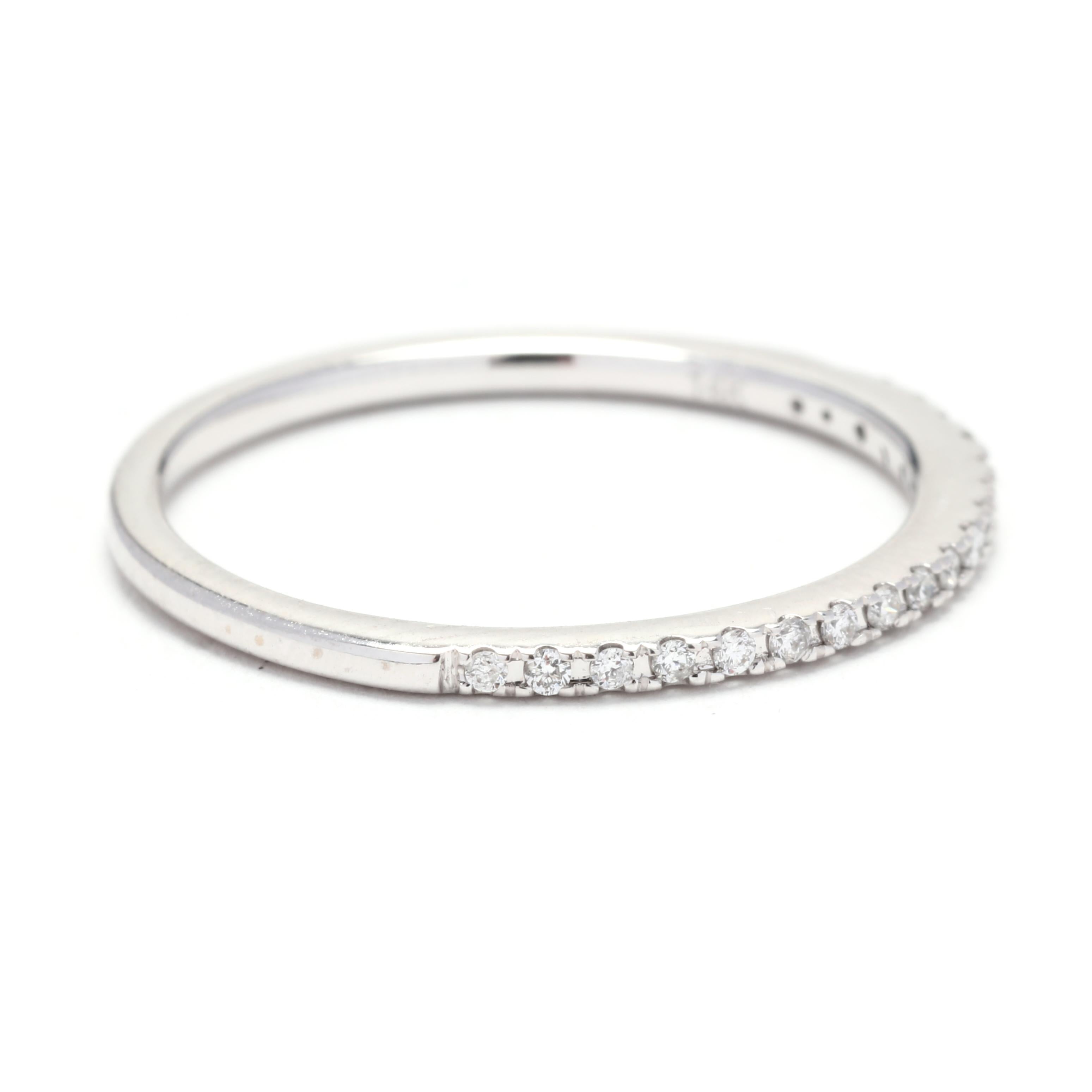 This beautiful thin diamond wedding band is crafted in platinum and features a total carat weight of 0.25ctw. The ring size is 4.75, making it a perfect fit for a petite finger. The delicate design of this band makes it ideal for stacking with other