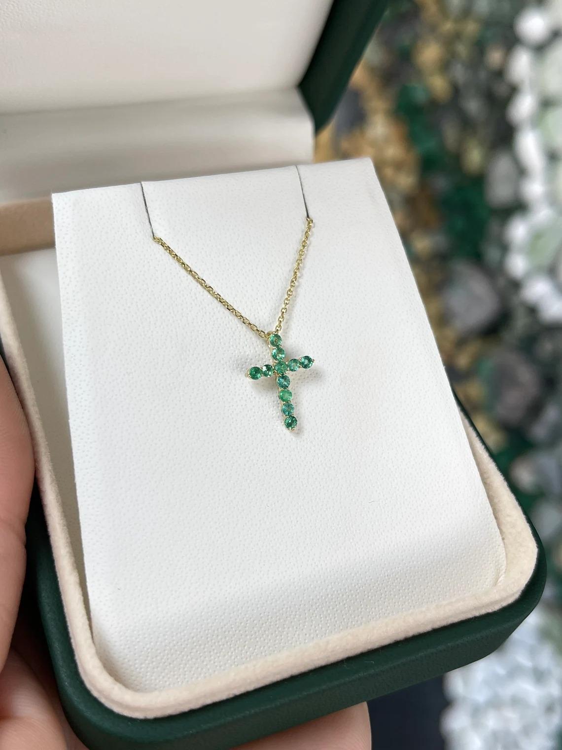 Modern 0.25tcw 14K Natural Round Emerald Petite Unisex Gold Religious Cross Pendant For Sale