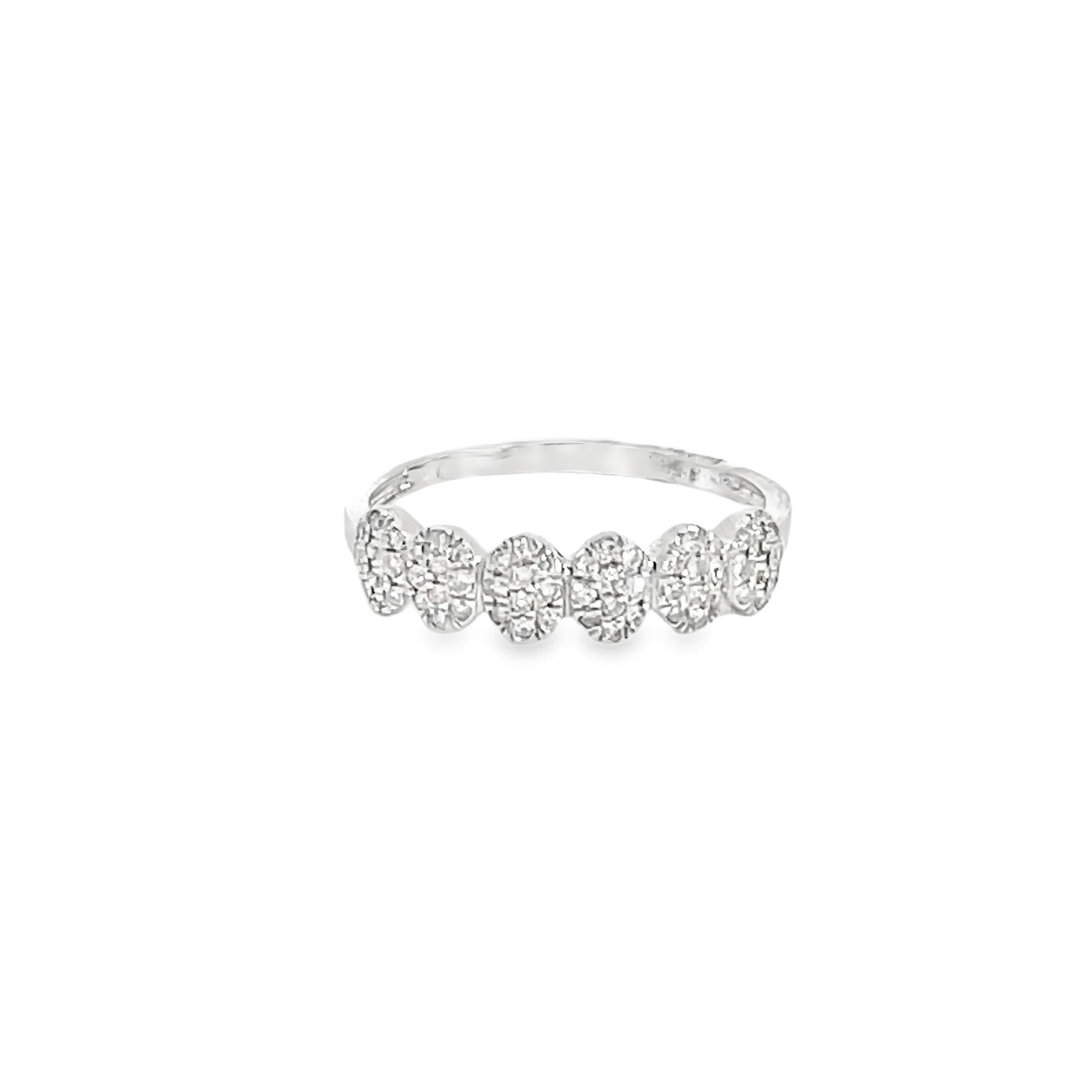 This stunning ring contains 0.15 Carats of Single Cut Round White Diamonds. It features six beautiful Diamond Oval Clusters. This ring is set in 14K White Gold.
Total Diamond Weight = 0.26 Carats. Ring Size is 7.00

This Diamond Ring is a stunning