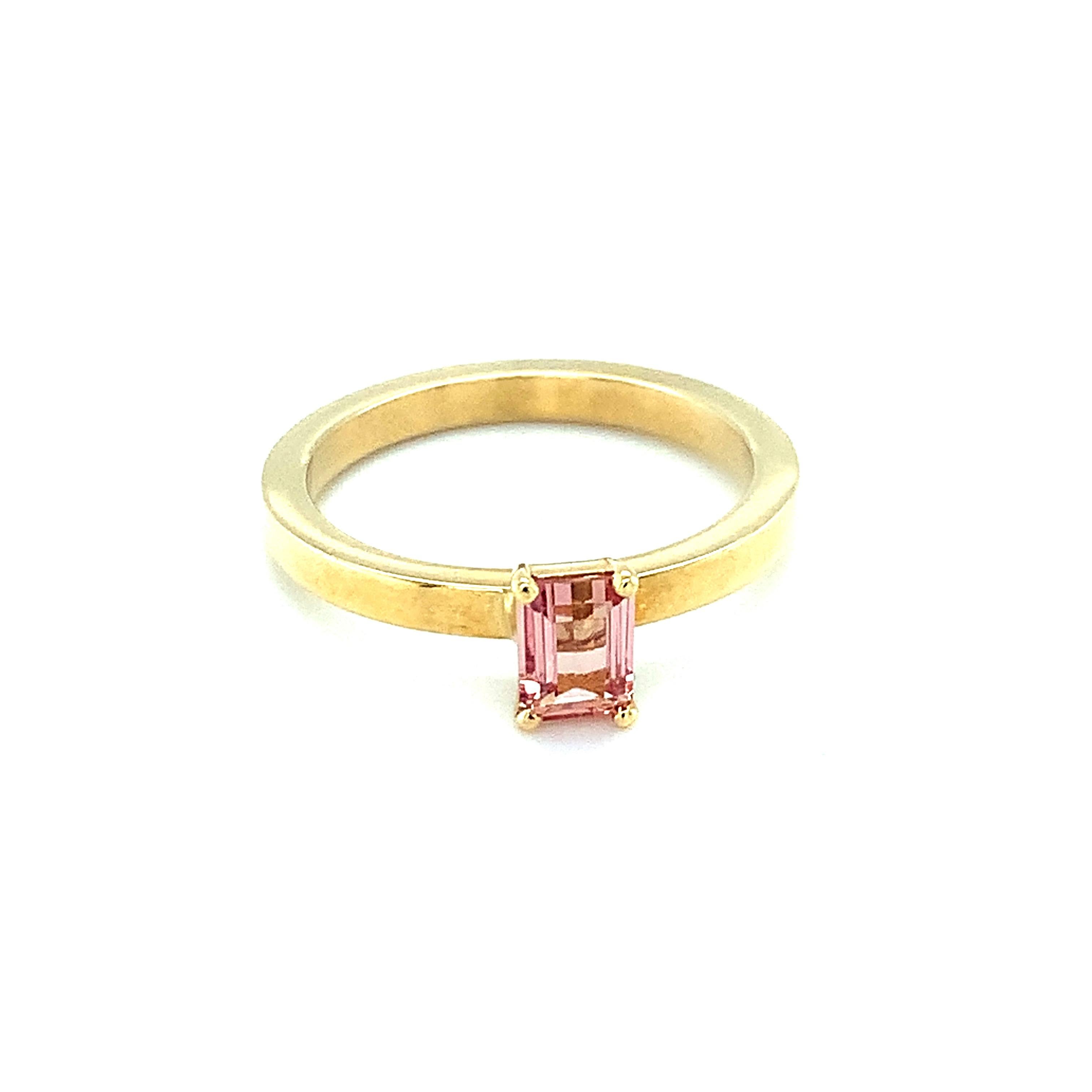 Simple and fun, this stackable topaz ring is a great for everyday. The rectangular topaz is a lovely peachy color and weighs .26 carats. Set in 18k yellow gold, this pretty ring makes a perfect gift for someone special or to yourself! Topaz is the