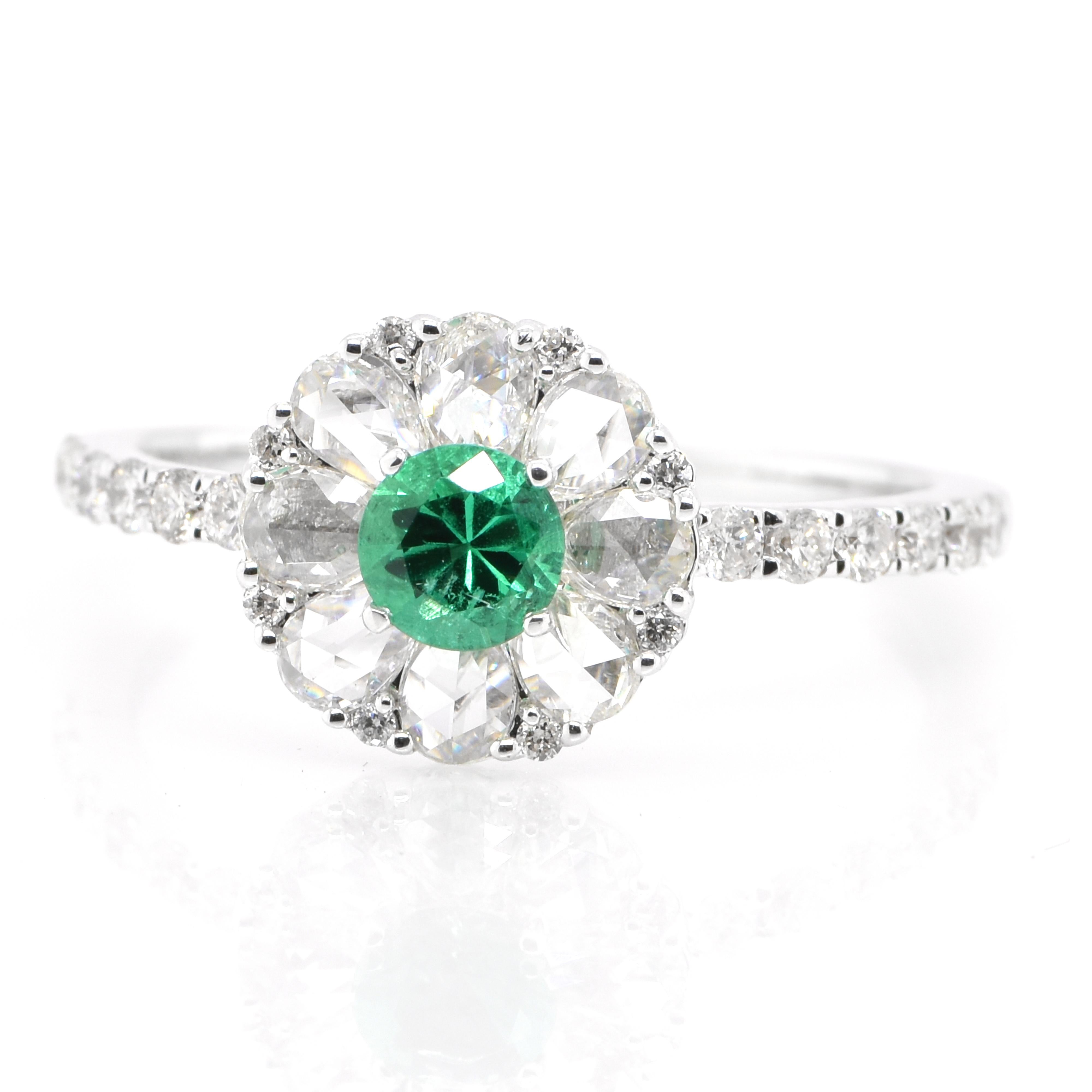 A stunning ring featuring a 0.26 Carat Natural Emerald and 0.80 Carats of Diamond Accents set in 18 Karat White Gold. People have admired emerald’s green for thousands of years. Emeralds have always been associated with the lushest landscapes and