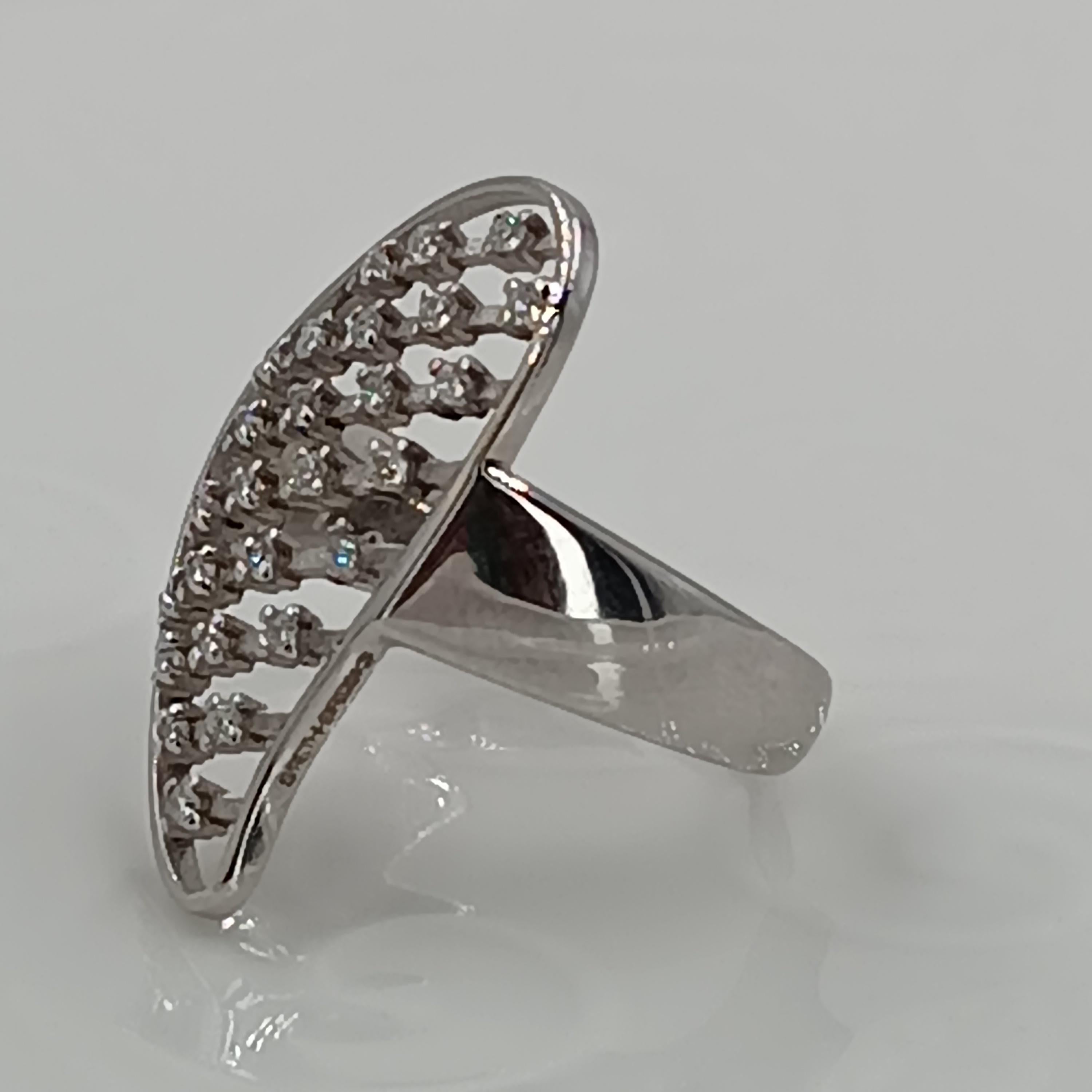 This wonderful Leo Milano ring from our Palestro  collection shows in every detail a very complicate yet perfectly done workmanship. The ring is in 18 carat white gold .The ring weight 5.57 grams the total diamonds  are  0.26 carats. 
any item of