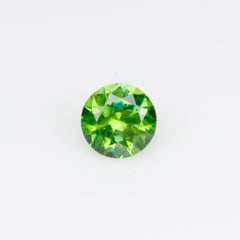 0.26 ct, Russian demantoid garnet with bissolite inclusions