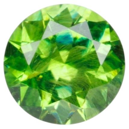 0.26 ct, Russian demantoid garnet with bissolite inclusions
