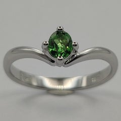 Oval Cut Emerald 4-Prong Solitaire Ring in 18k White Gold