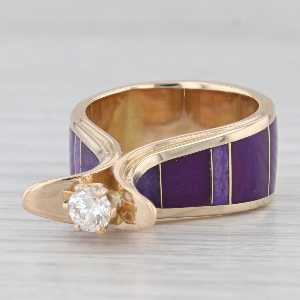 Gemstone Information:
- Natural Diamond -
Carats - 0.27ct 
Cut - Round Brilliant
Color - H - I
Clarity - VS2

- Natural Sugilite -
Cut - Flat Contoured
Color - Purple

Metal: 14k Yellow Gold
Weight: 9.6 Grams 
Stamps: 14k
Face Height: 4.8 mm 
Rise