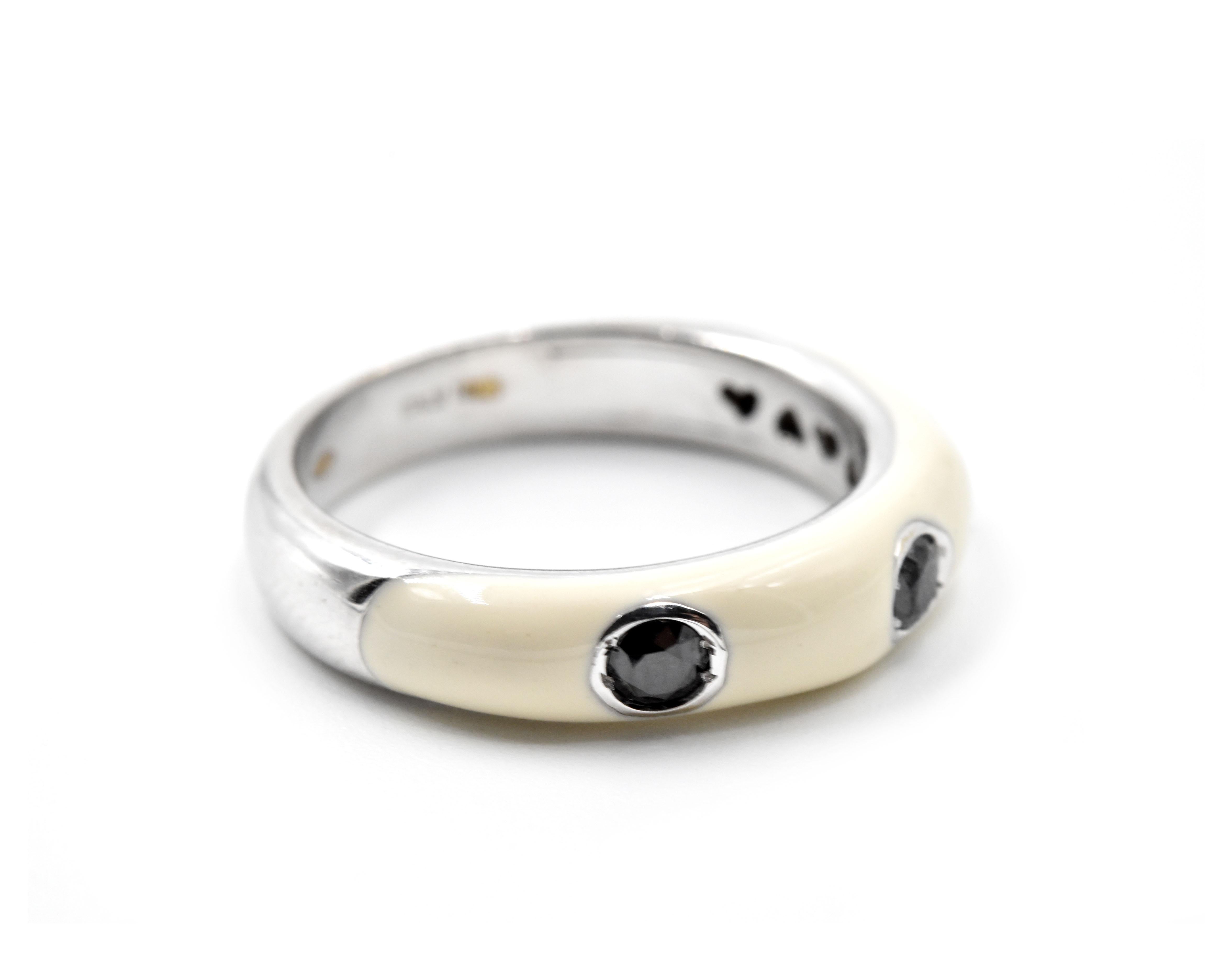 Designer: custom design
Material: 18k white gold
Black Diamonds: three round brilliant cuts = 0.28 carat total weight 
Ring Size: 7
Weight: 5.49 grams
