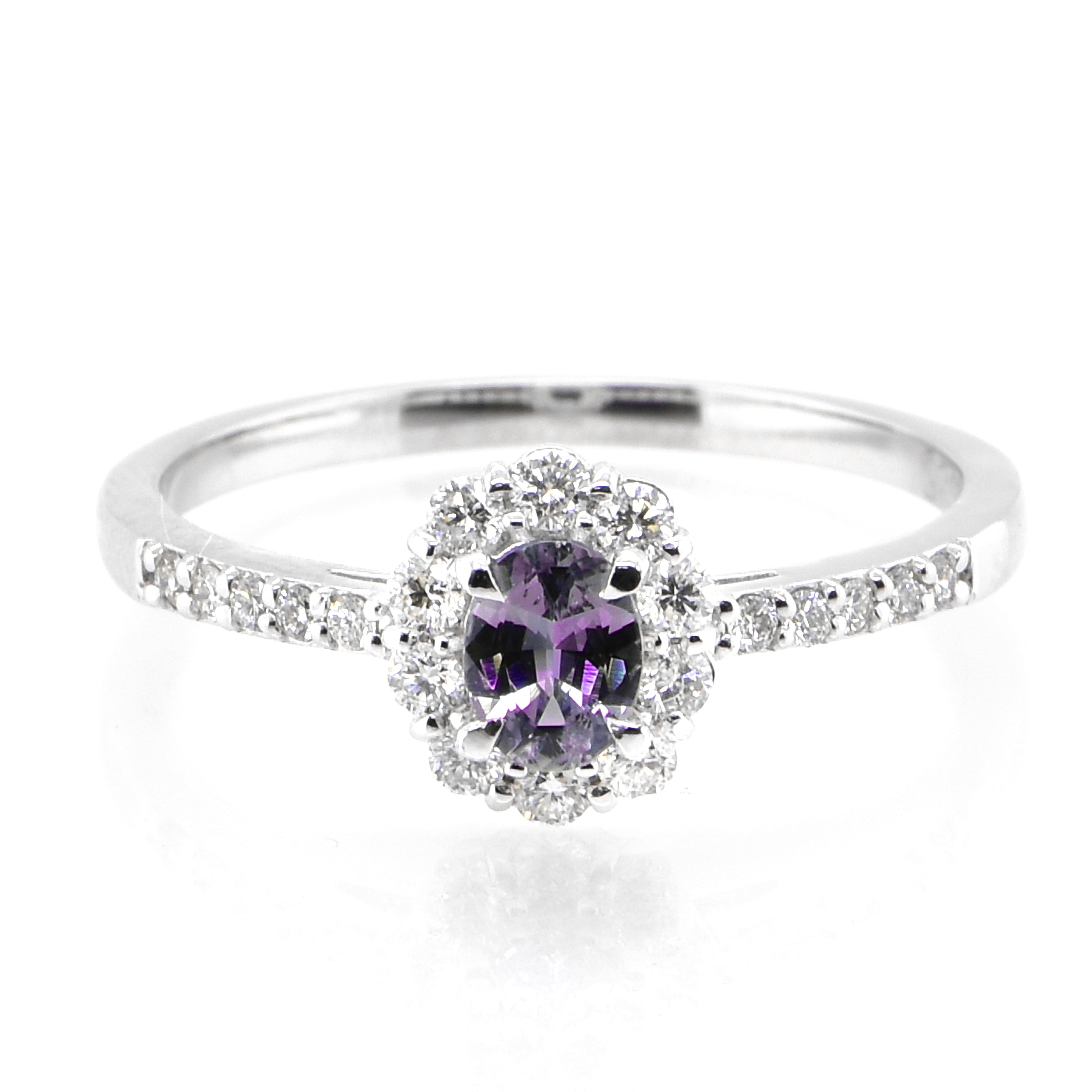 A gorgeous ring featuring 0.28 Carat, Natural Alexandrite and 0.25 Carats of Diamond Accents set in Platinum. Alexandrites produce a natural color-change phenomenon as they exhibit a Bluish Green Color under Fluorescent Light whereas a Purplish Red