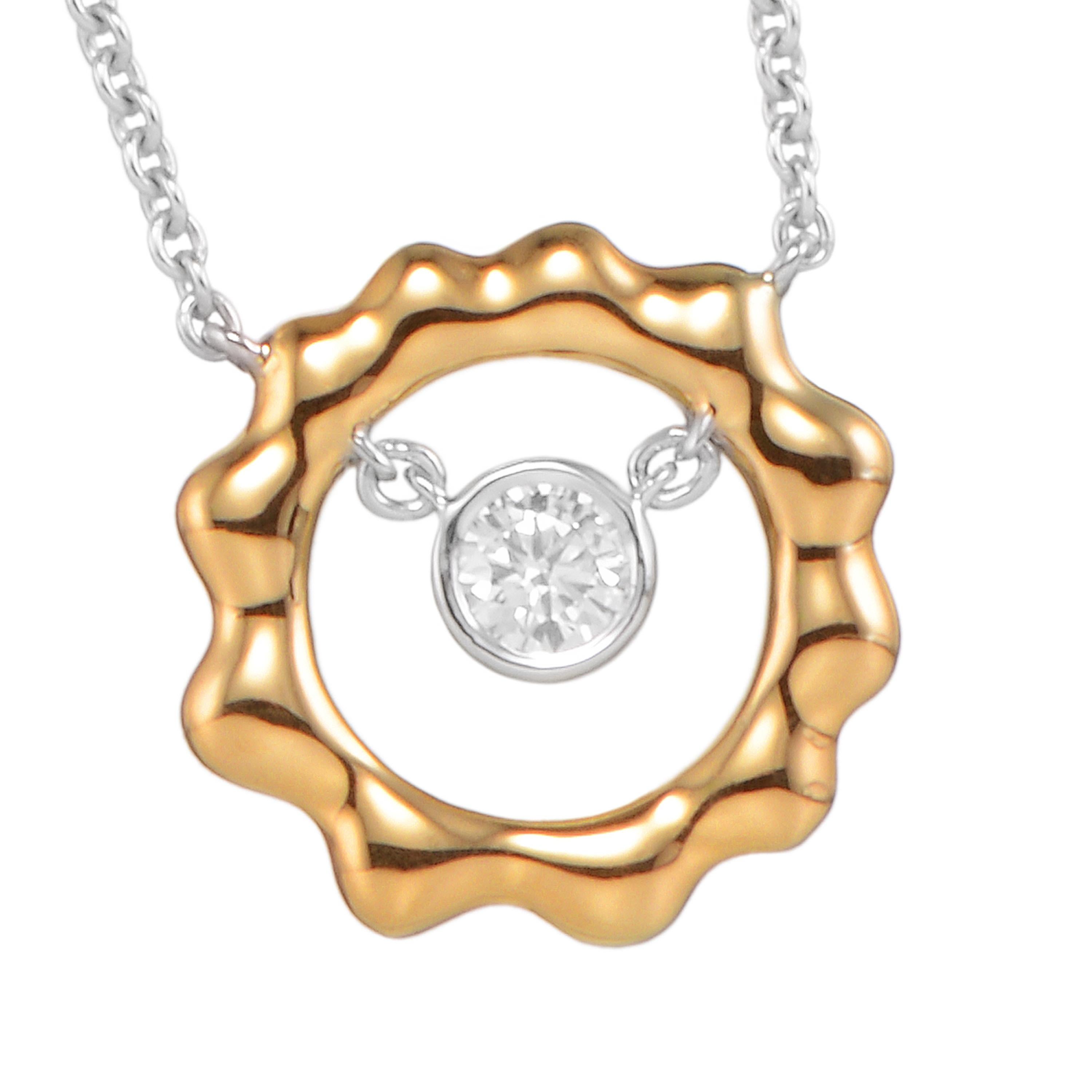 Cast in the shape of the sun, Butani's pendant necklace is handcrafted from 18-karat yellow and white gold and has a 0.28 carat brilliant-cut round diamond center illuminated by a yellow gold sun silhouette.  Wear it solo or layered with other